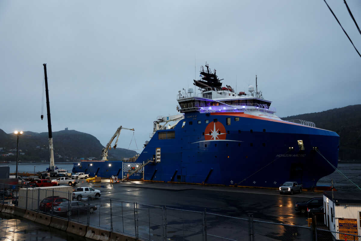 Equipment that was flown in by U.S. Air Force transport planes is loaded onto the offshore vessel Horizon Arctic, before its deployment to the search area of a missing OceanGate Expeditions submersible which had been carrying five people to explore the sunken Titanic, in the port of St. John’s, Newfoundland, Canada June 20, 2023. REUTERS