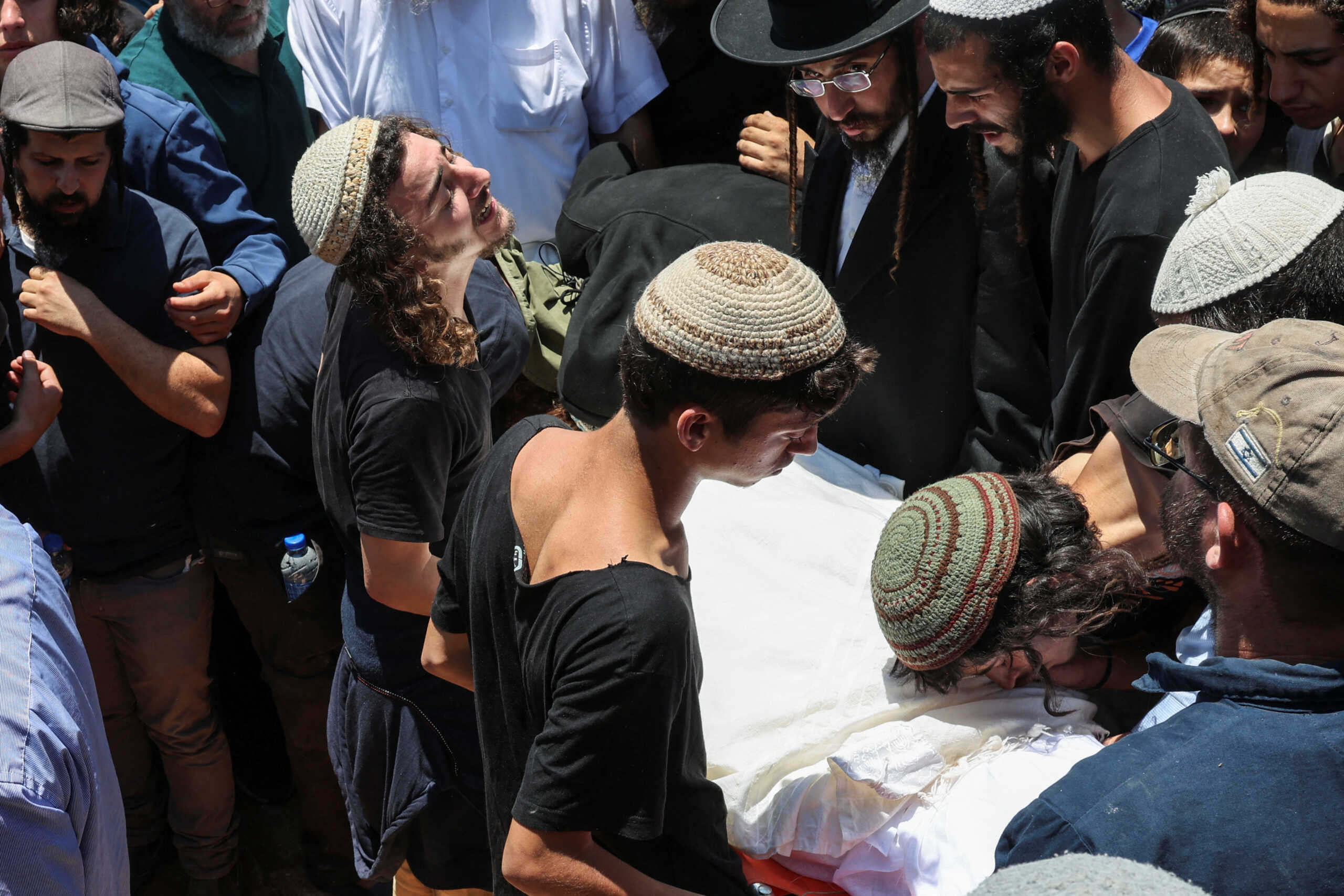 Mourners attend the funeral of 17-year-old Nachman Shmuel Mordoff, who was killed in a Palestinian shooting attack along with three other Israelis near the Jewish settlement of Eli, in Shilo in the Israeli-occupied West Bank June 21, 2023. REUTERS
