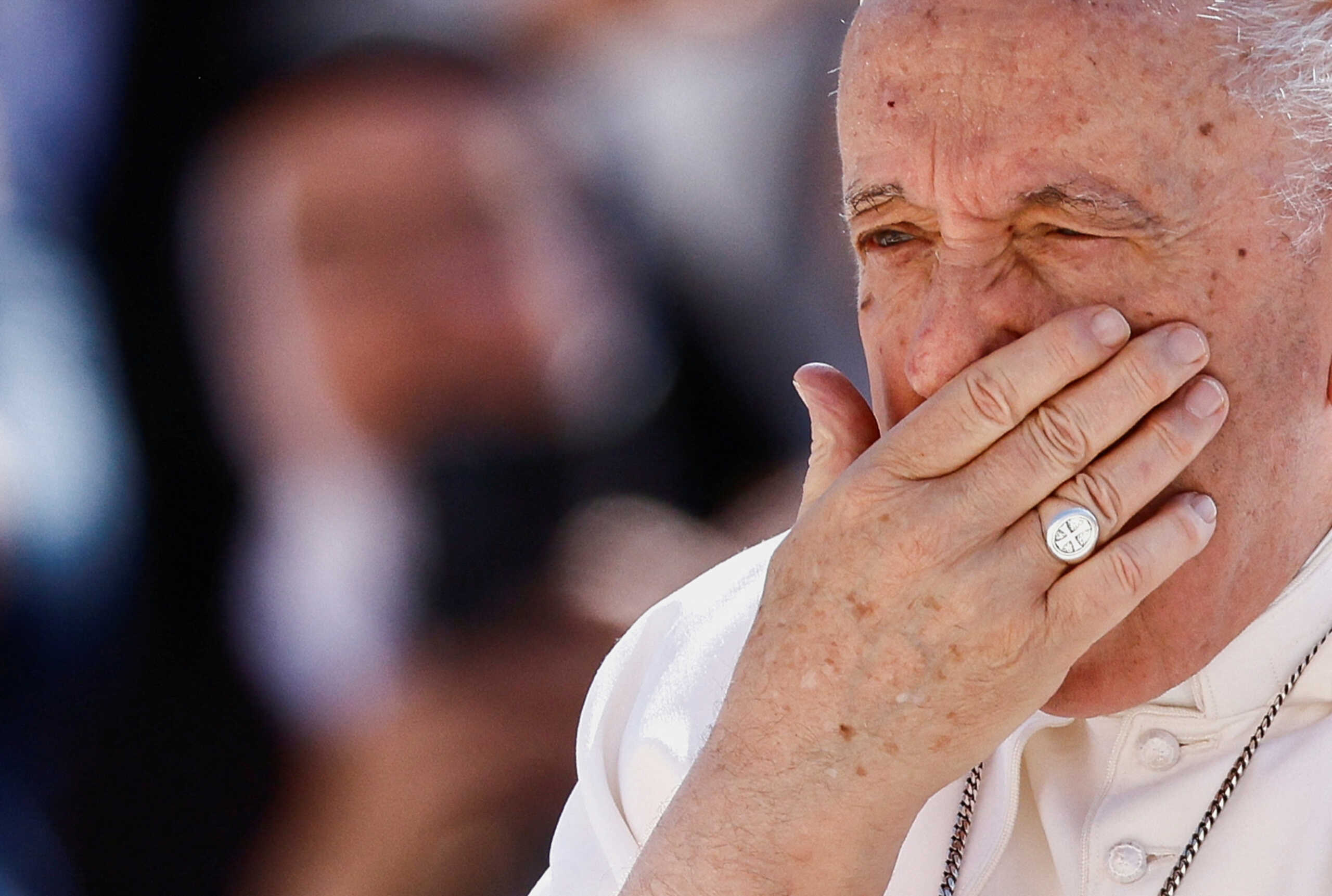 Pope Francis reacts as he arrives for the weekly general audience on the day he is due to undergo abdominal surgery, in St. Peter's Square at the Vatican, June 7, 2023. REUTERS