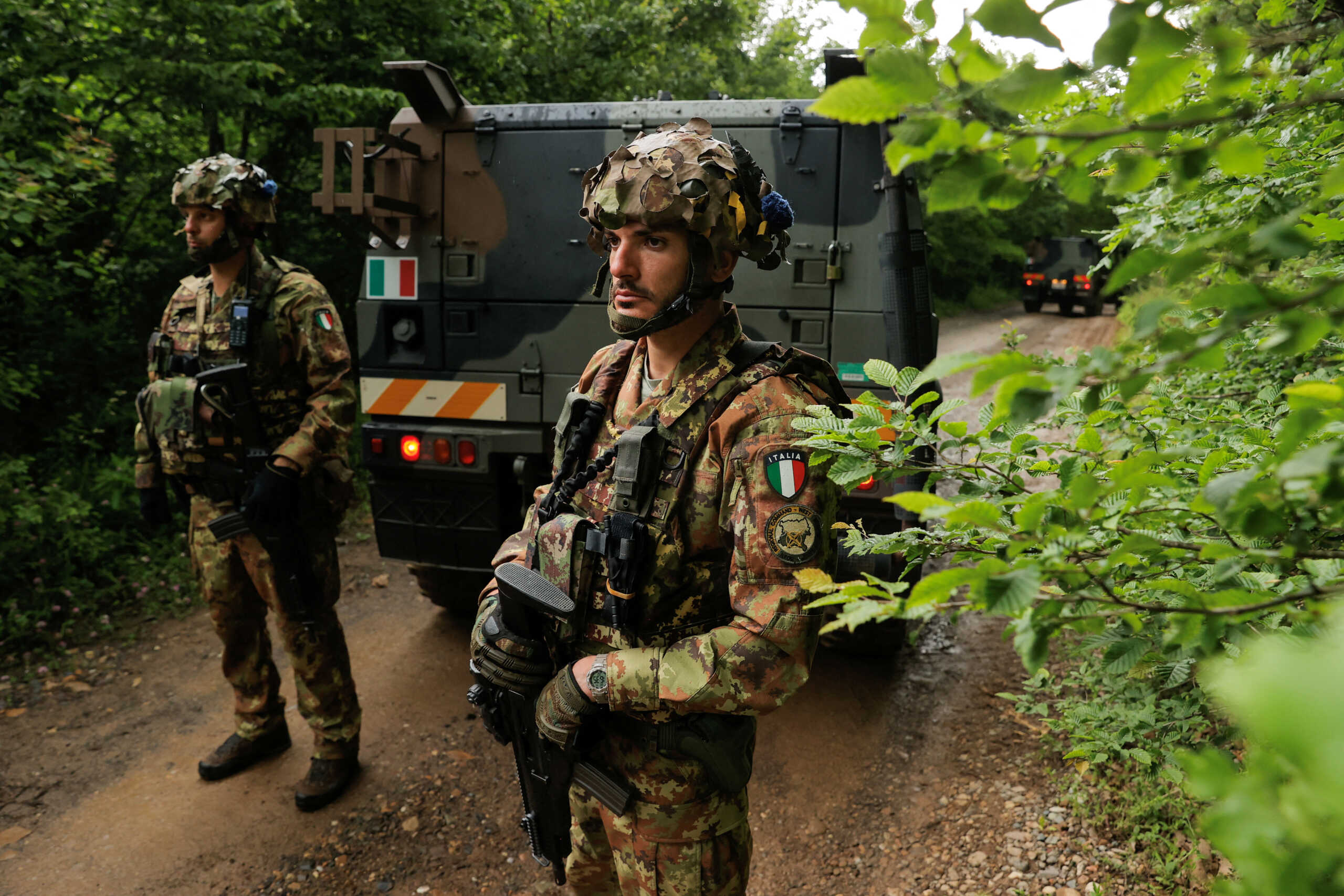 Italian NATO Kosovo Force (KFOR) peacekeepers guard the site near the village of Bare, Kosovo, June 14, 2023. Three Kosovo police officers were detained by Serbian forces on Wednesday but officials from Kosovo and Serbia gave different locations for the arrest, accusing each other of crossing the border illegally. REUTERS