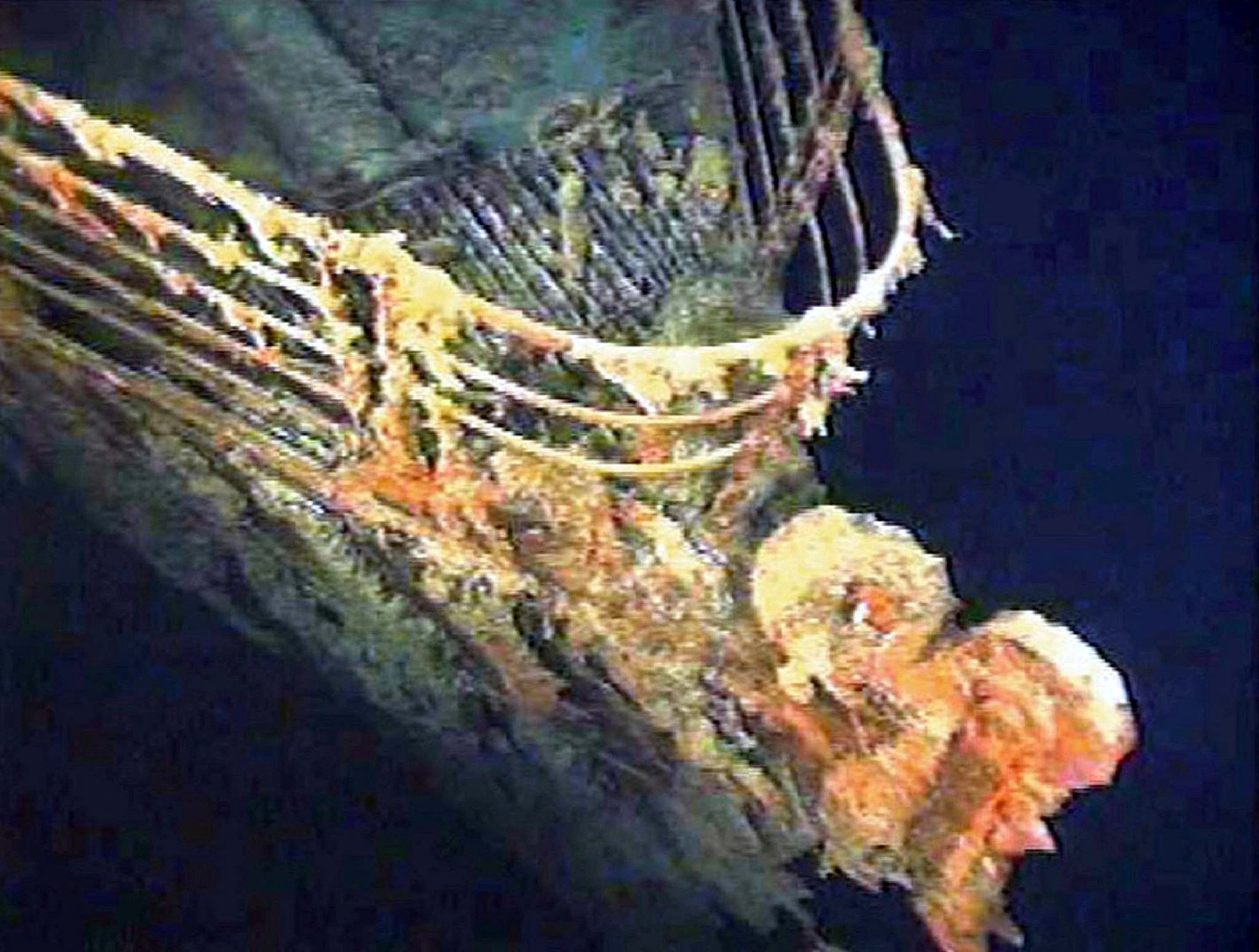 FILE PHOTO: The port bow railing of the Titanic lies in 12,600 feet of water about 400 miles east of Nova Scotia as photographed earlier this month as part of a joint scientific and recovery expedition sponsored by the Discovery Channel and RMS Titantic. Scientists plan to illuminate and then raise the hull section of this legendary ocean liner later this month. Reuters
