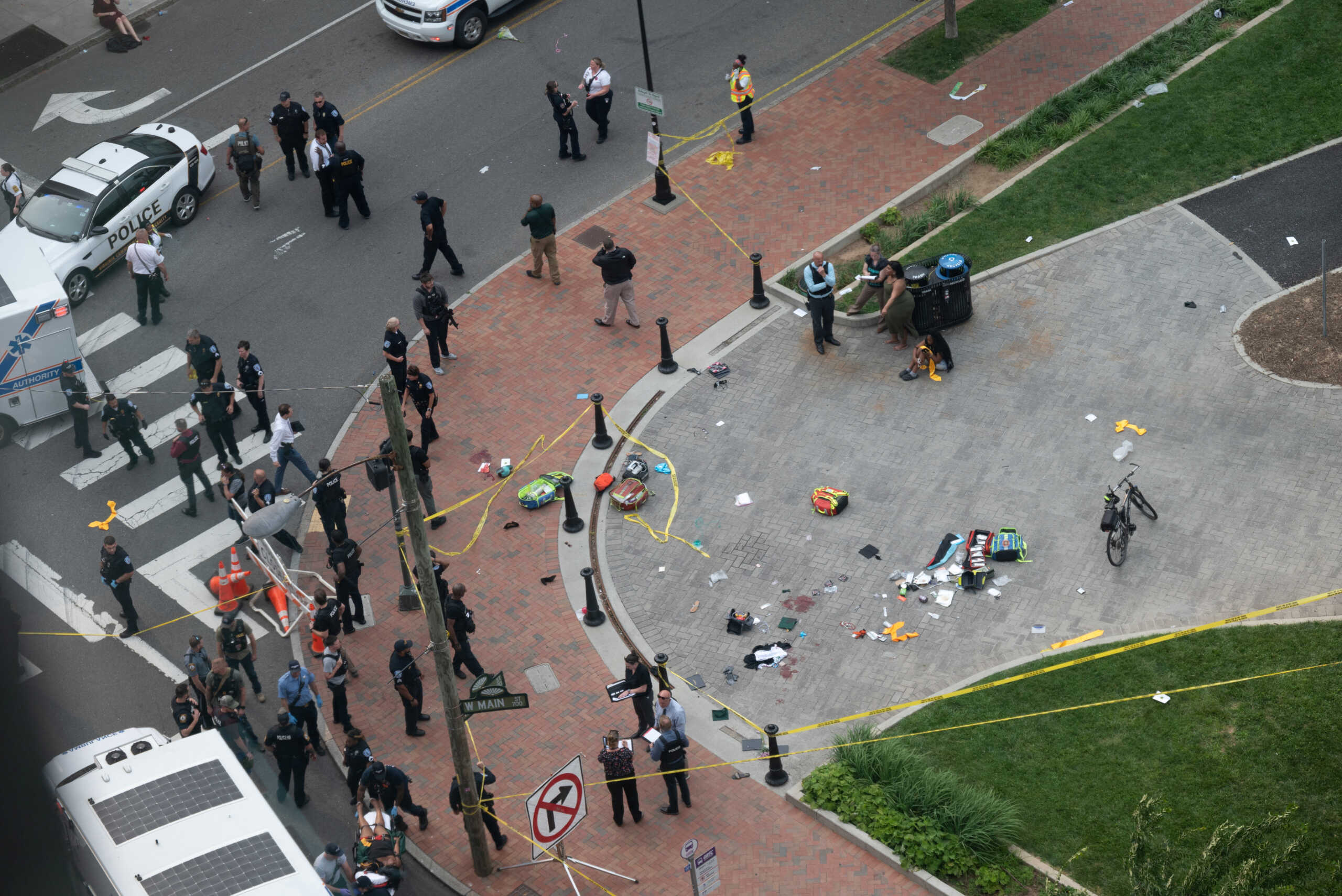 Law enforcement officers investigate at the scene after a gunman opened fire in a park as high school graduates and their families emerged from a theater where commencement exercises had just concluded, in Richmond, Virginia, U.S. June 6, 2023 in this picture obtained from social media. Clark Frierson