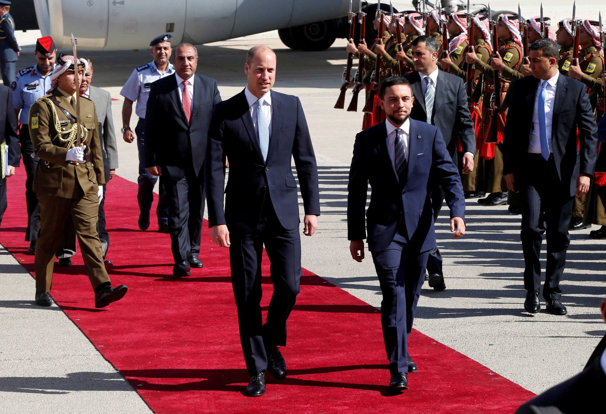 FILE PHOTO: Britain's Prince William and Jordan's Crown Prince Hussein bin Abdullah II review the honour guard in Amman, Jordan, June 24, 2018. REUTERS