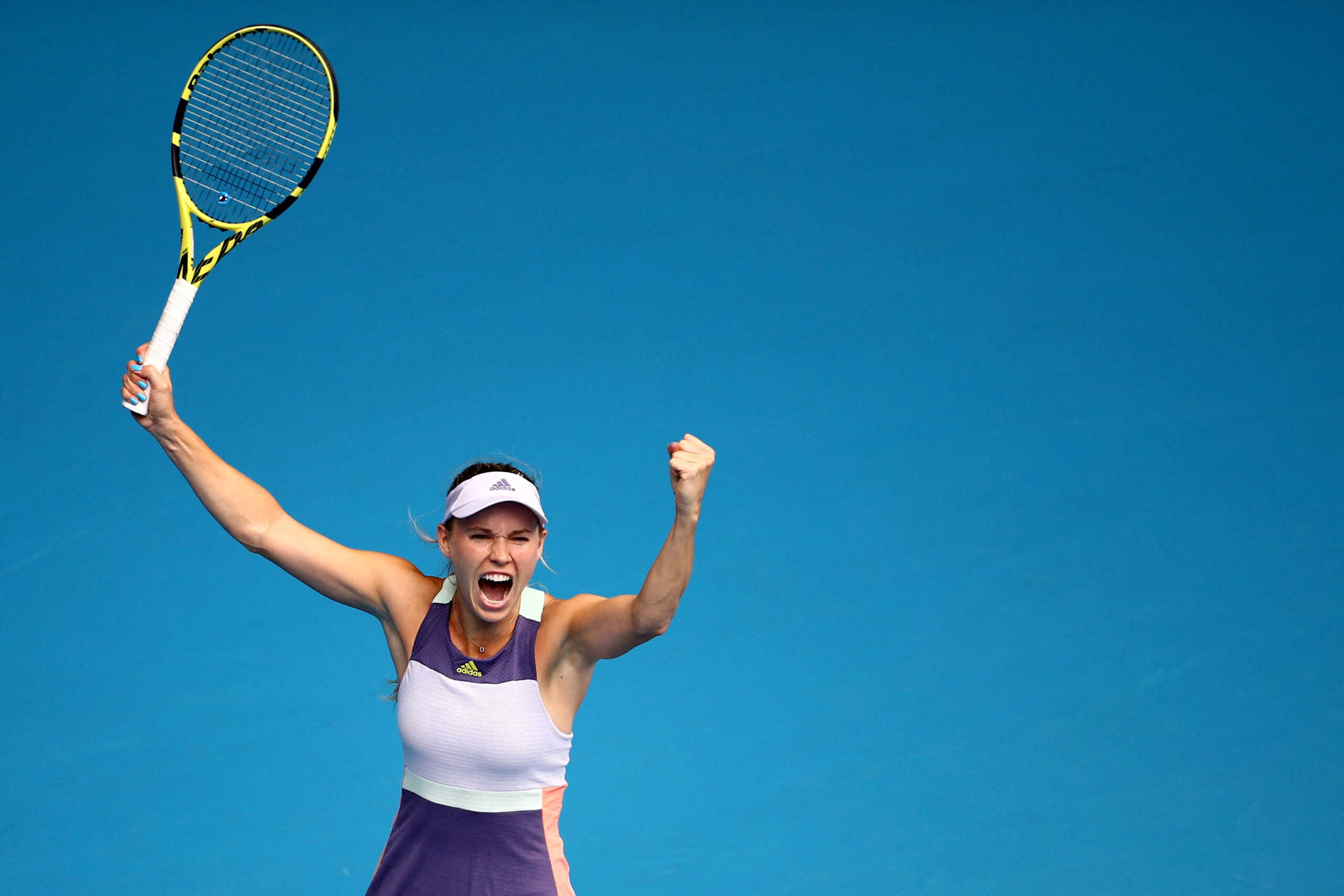 FILE PHOTO: Tennis - Australian Open - Second Round - Melbourne Park, Melbourne, Australia - January 22, 2020 Denmark's Caroline Wozniacki celebrates winning the match against Ukraine's Dayana Yastremska REUTERS
