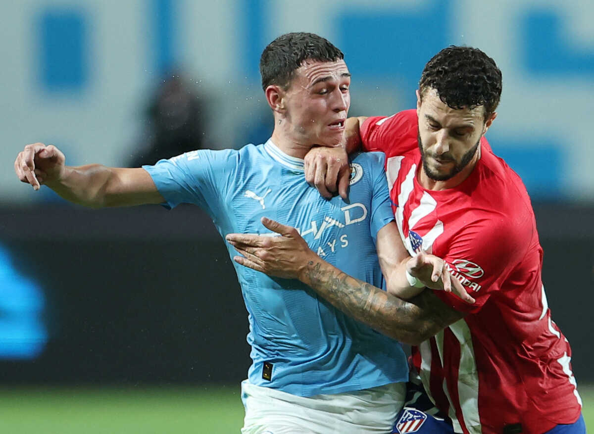 Soccer Football - Pre-Season Friendly - Atletico Madrid v Manchester City - Seoul World Cup Stadium, Seoul, South Korea - July 30, 2023 Manchester City's Phil Foden in action with Atletico Madrid's Mario Hermoso REUTERS