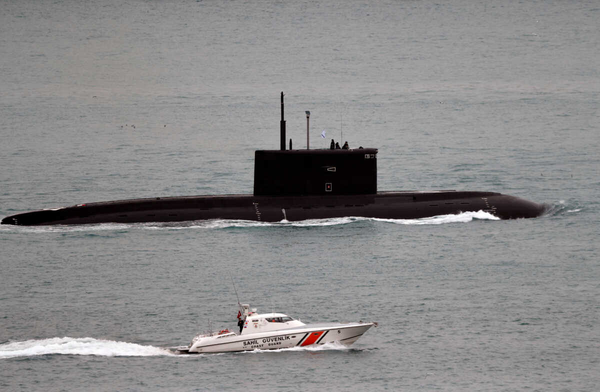 FILE PHOTO: A Turkish Coast Guard boat escorts Russian Kilo-class diesel-electric submarine Krasnodar as it sails in the Bosphorus, on its way to the Mediterranean Sea, in Istanbul, Turkey, March 14, 2019. REUTERS
