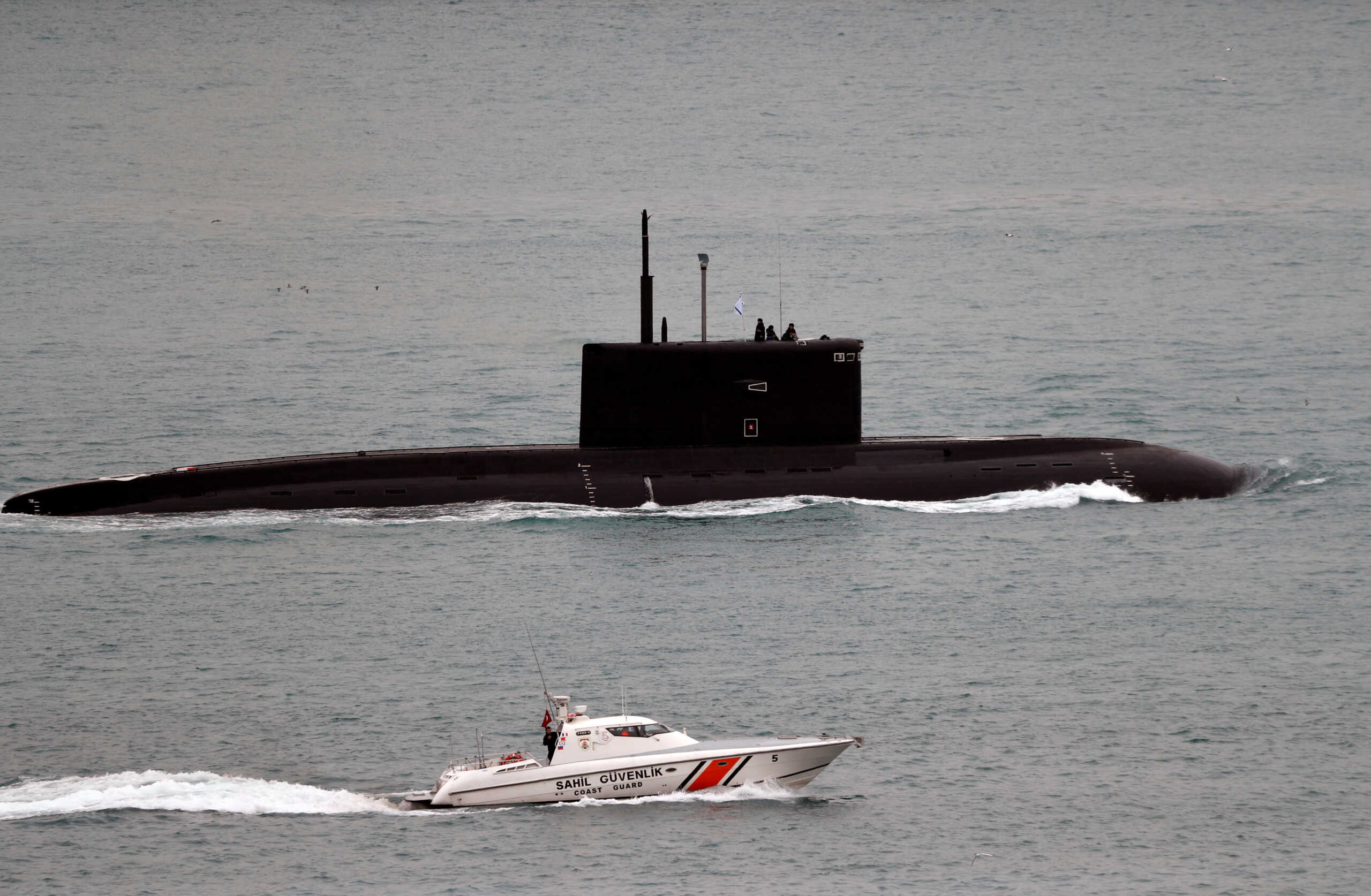 FILE PHOTO: A Turkish Coast Guard boat escorts Russian Kilo-class diesel-electric submarine Krasnodar as it sails in the Bosphorus, on its way to the Mediterranean Sea, in Istanbul, Turkey, March 14, 2019. REUTERS
