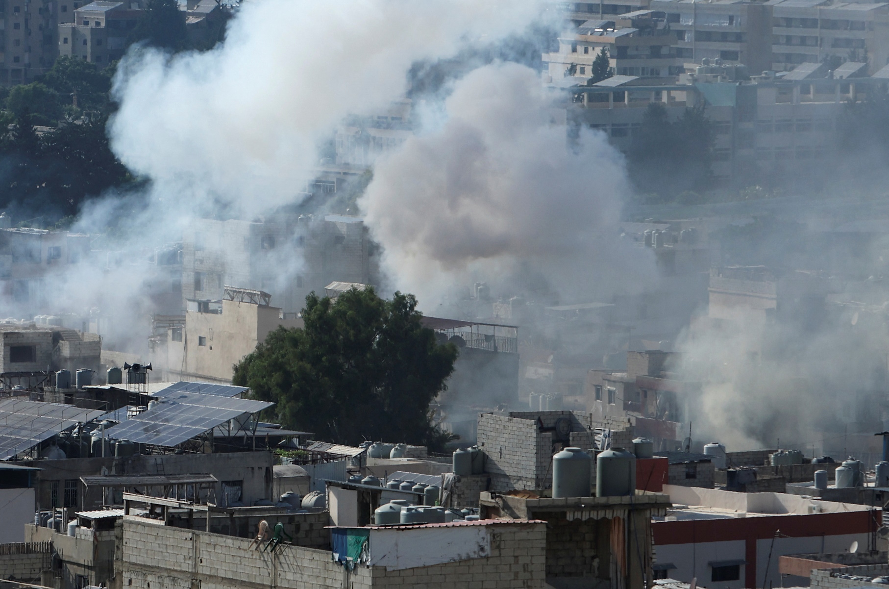 Smoke rises from Ain el-Hilweh Palestinian refugee camp during Palestinian faction clashes, in Sidon, Lebanon July 30, 2023. REUTERS