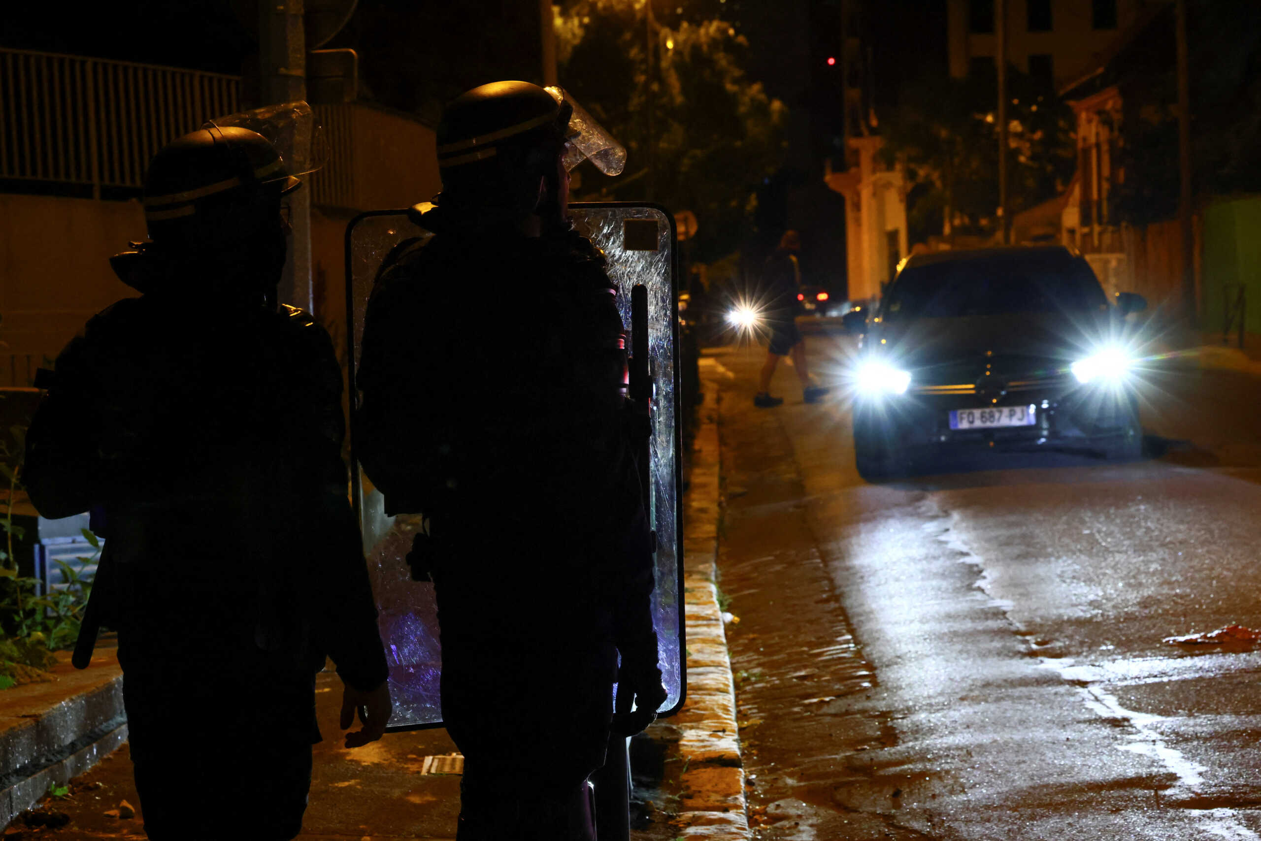 Police stand guard as unrest continues following the death of a 17-year-old teenager killed by a French police officer during a traffic stop, in Nanterre, Paris suburb, France, July 1, 2023. REUTERS
