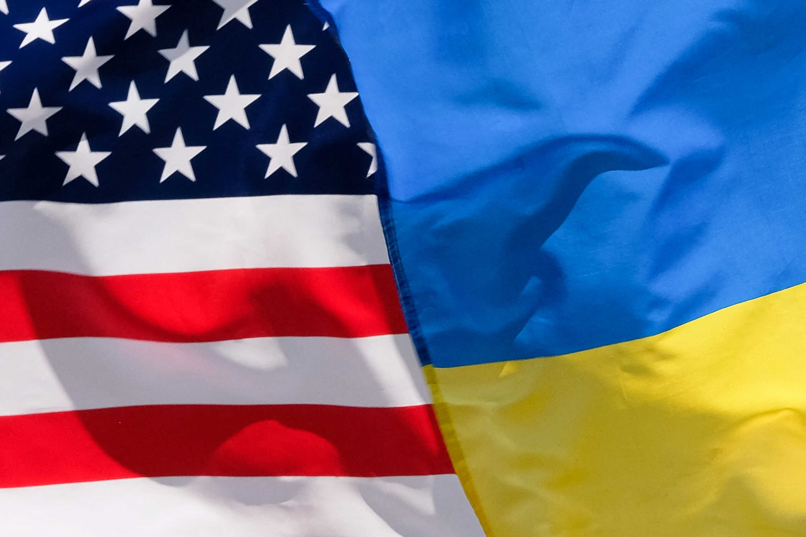 The American and Ukrainian flags wave next to each during an Independence Day parade in Washington D.C., U.S., July 4, 2023.  REUTERS