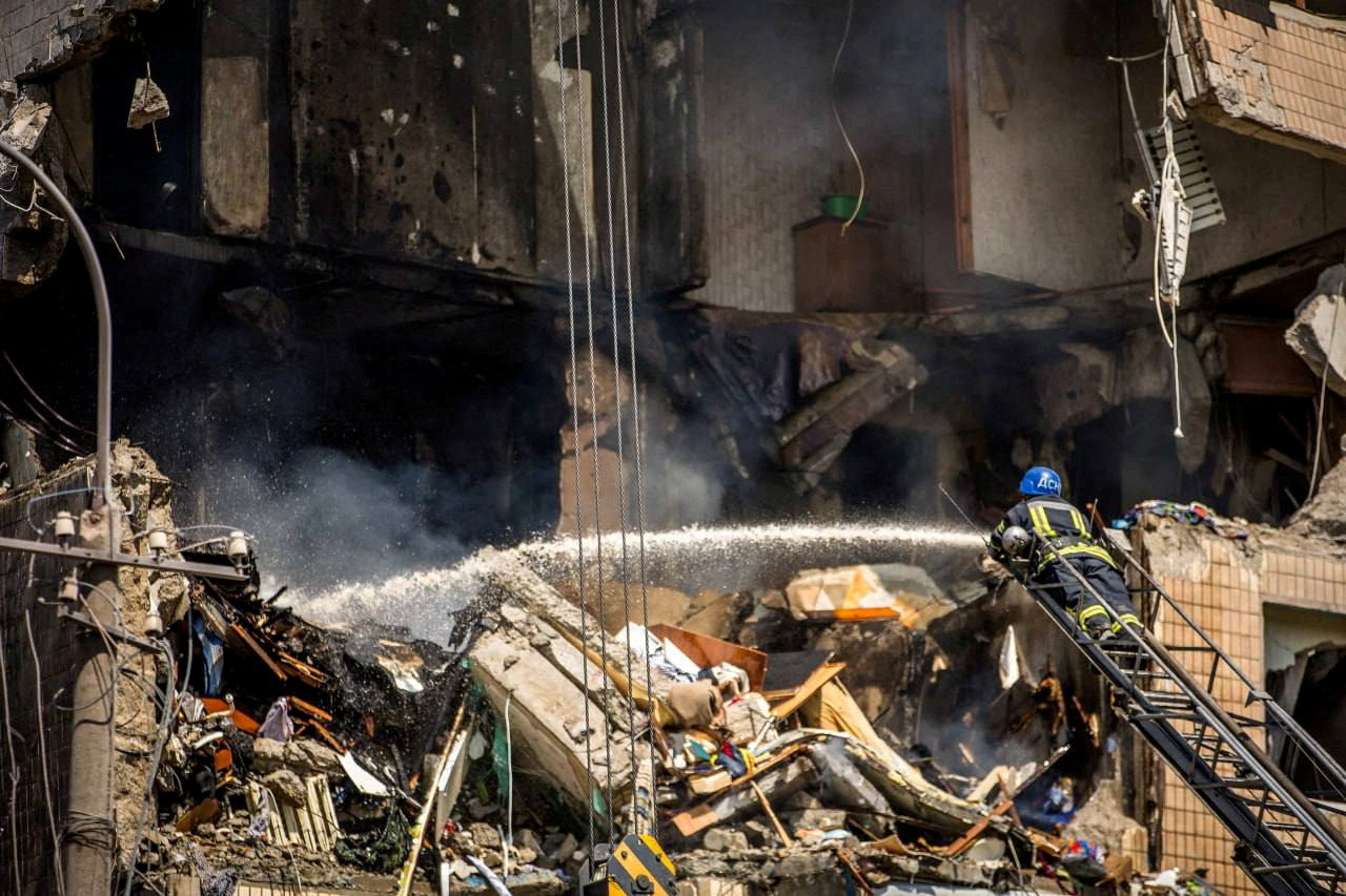 A firefighter works at a site of an apartment building heavily damaged by a Russian missile strike, amid Russia's attack on Ukraine, in Kryvyi Rih, Ukraine July 31, 2023.  Press service of the State Emergency Service of Ukraine