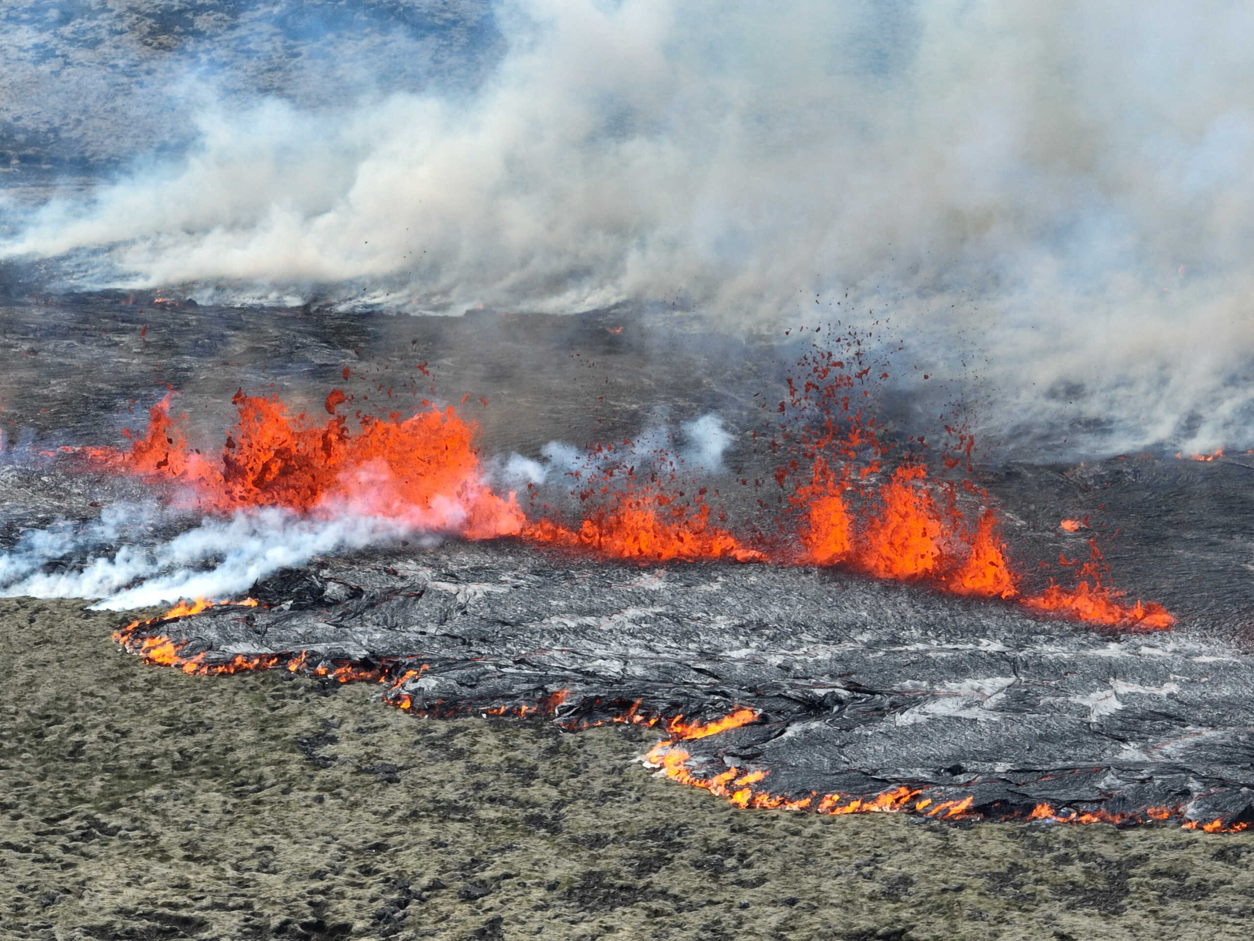 Smoke billows and lava spurts after the eruption of a volcano, on the Reykjanes peninsula, near the capital Reykjavik, in southwest Iceland, July 10, 2023, in this picture obtained from social media. Juergen Merz - Glacier Photo Artist