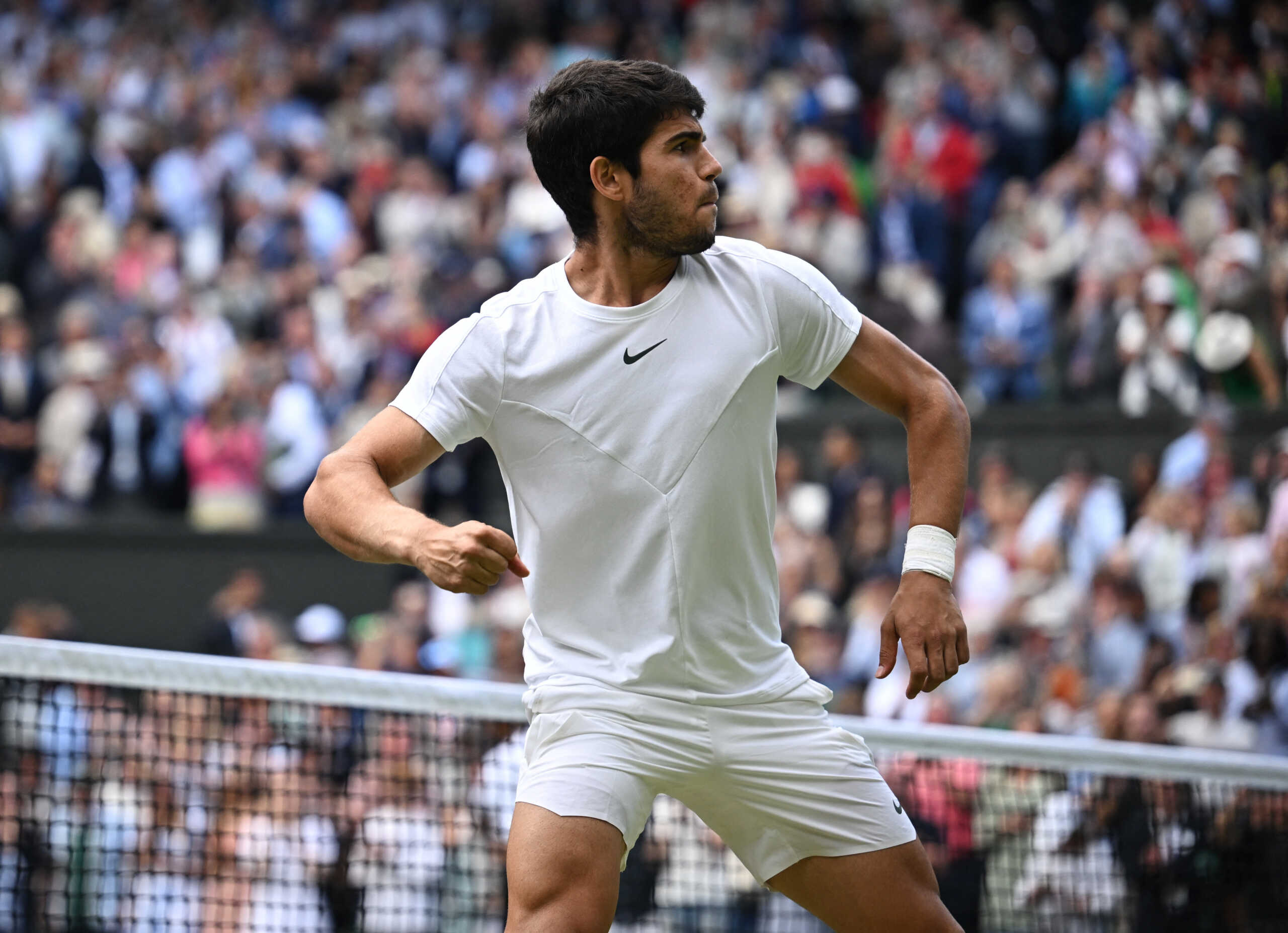 Tennis - Wimbledon - All England Lawn Tennis and Croquet Club, London, Britain - July 12, 2023 Spain's Carlos Alcaraz celebrates after winning his quarter final match against Denmark's Holger Rune REUTERS