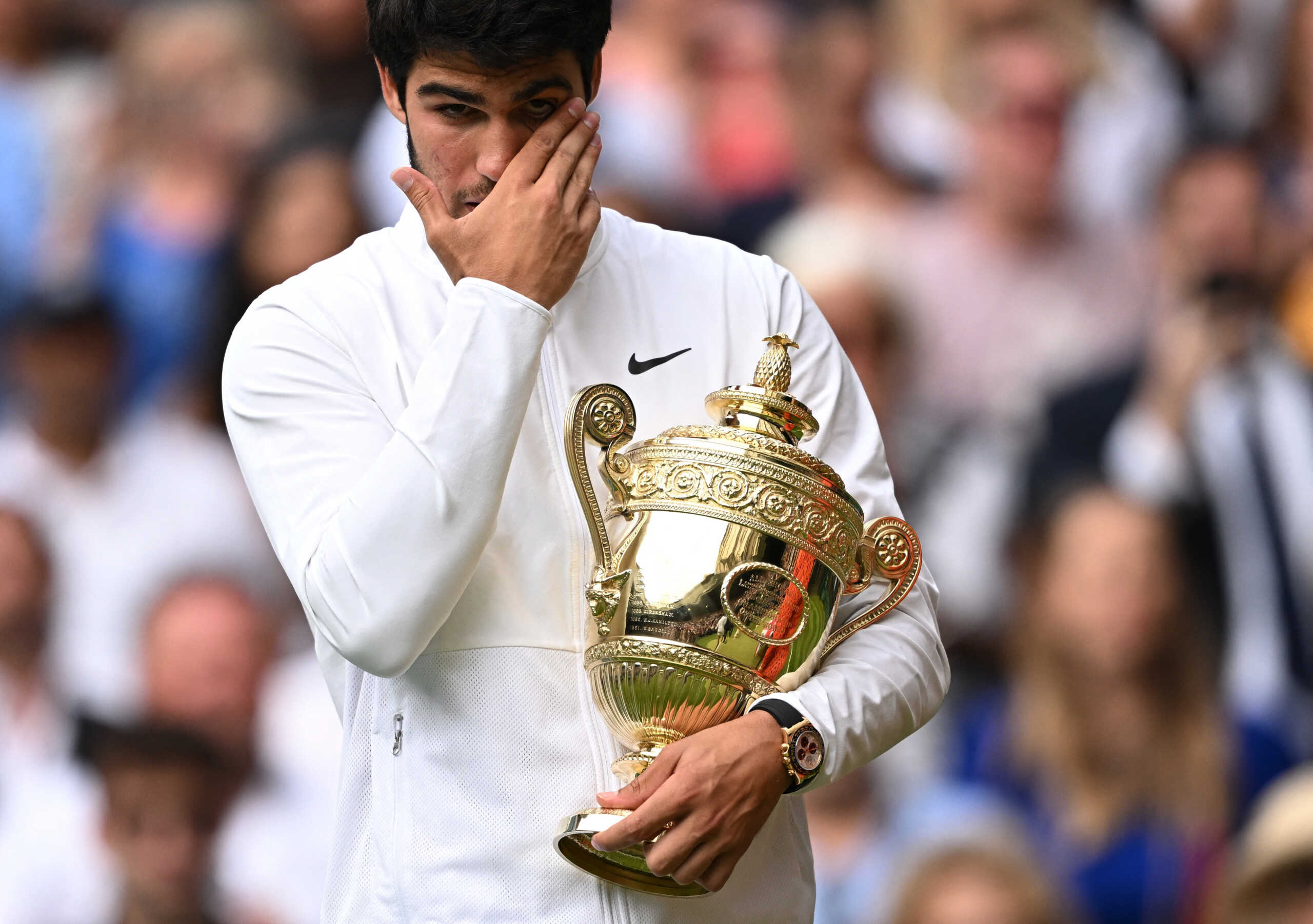 Tennis - Wimbledon - All England Lawn Tennis and Croquet Club, London, Britain - July 16, 2023 Spain's Carlos Alcaraz celebrates with the trophy after winning his final match against Serbia's Novak Djokovic REUTERS
