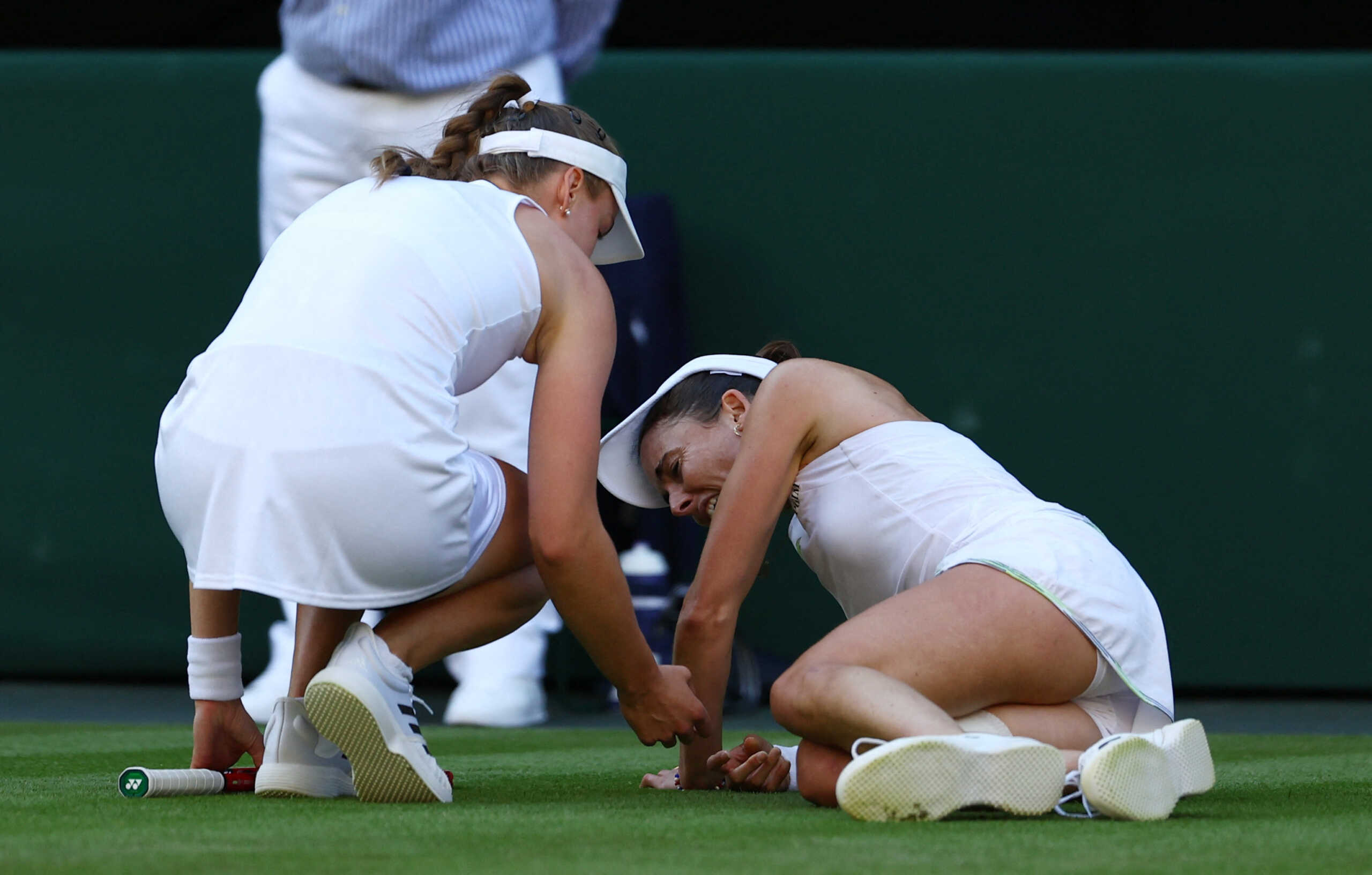 Tennis - Wimbledon - All England Lawn Tennis and Croquet Club, London, Britain - July 6, 2023 France's Alize Cornet reacts after sustaining an injury during her second round match against Kazakhstan’s Elena Rybakina REUTERS