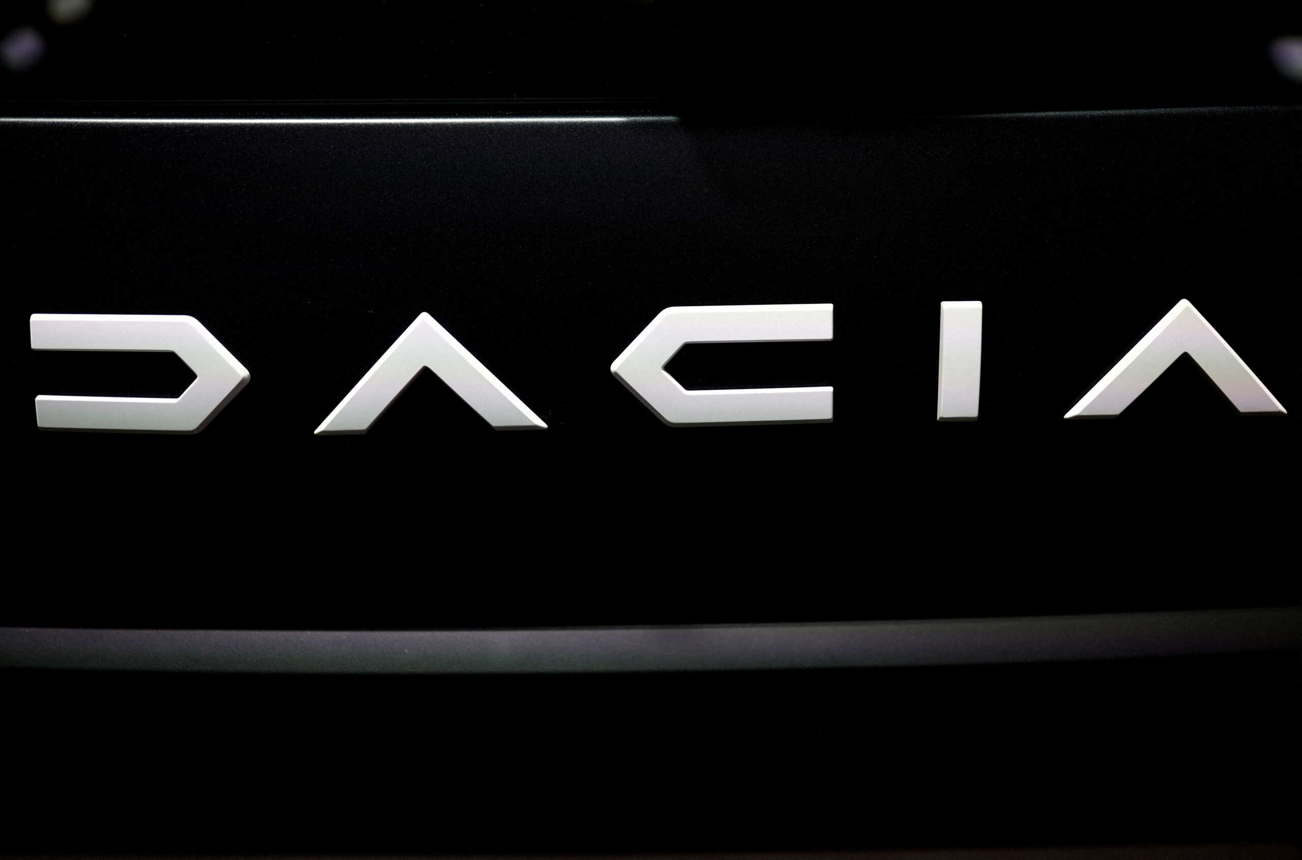 FILE PHOTO: The logo of Dacia is pictured at the 2022 Paris Auto Show in Paris, France October 18, 2022. REUTERS