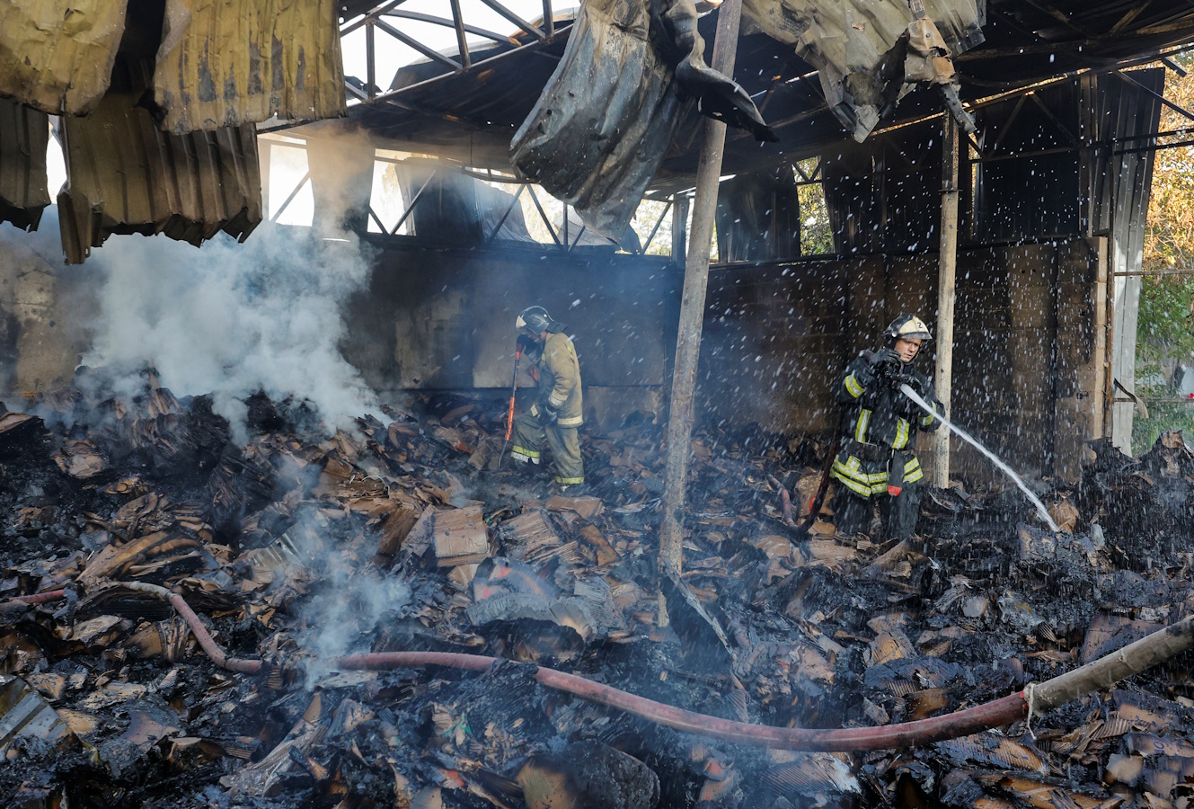 Firefighters work to extinguish fire at a warehouse destroyed in shelling in the course of Russia-Ukraine conflict in Donetsk, Russian-controlled Ukraine, July 24, 2023. REUTERS
