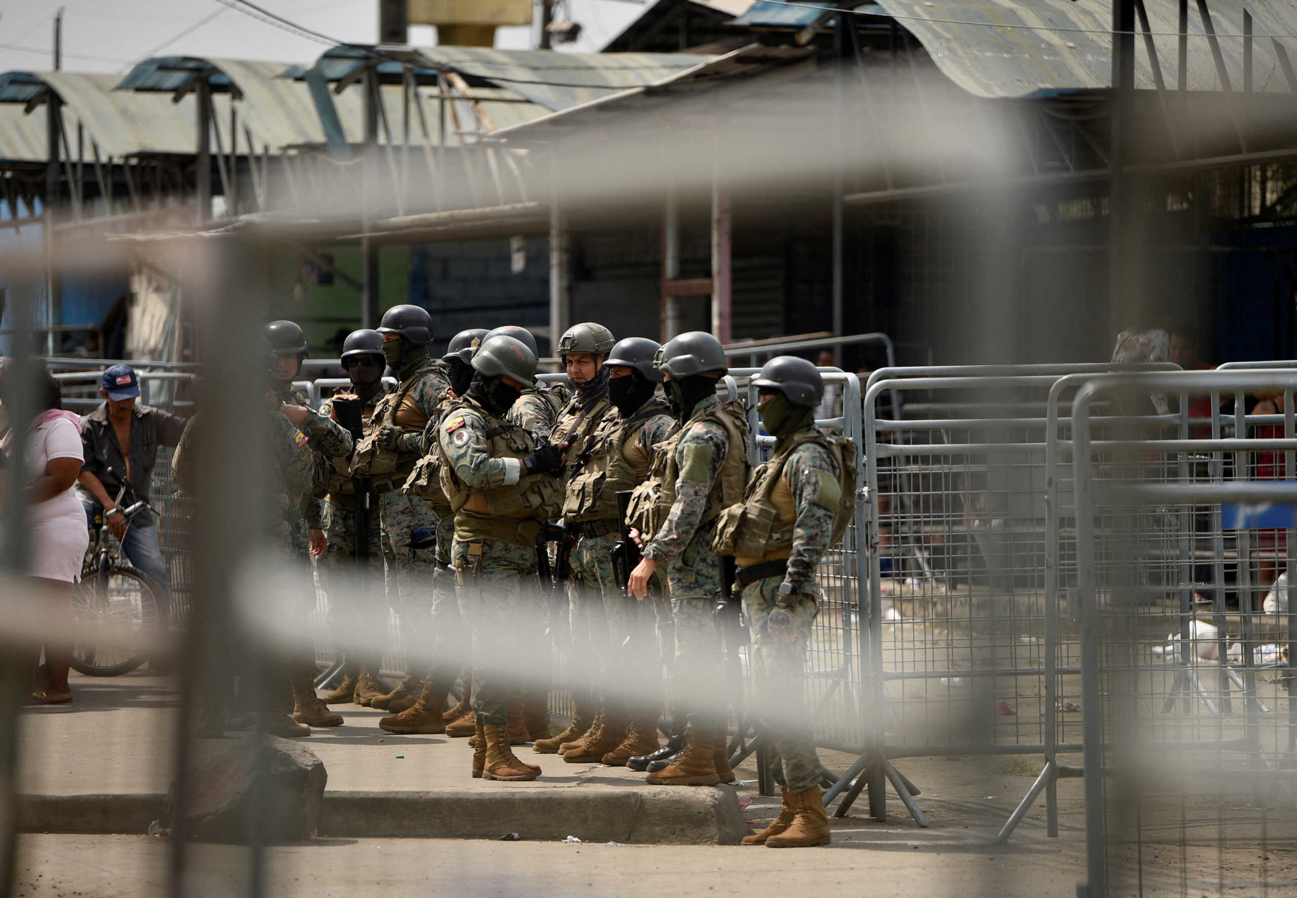 Ecuador's security forces stand guard outside the prison in Guayaquil, after Ecuador's government on Tuesday declared a 60-day state of emergency throughout the country's prisons and authorized armed forces to retake control of jails, following a wave of violence that left 18 dead over the weekend, in Guayaquil, Ecuador July 25, 2023. REUTERS