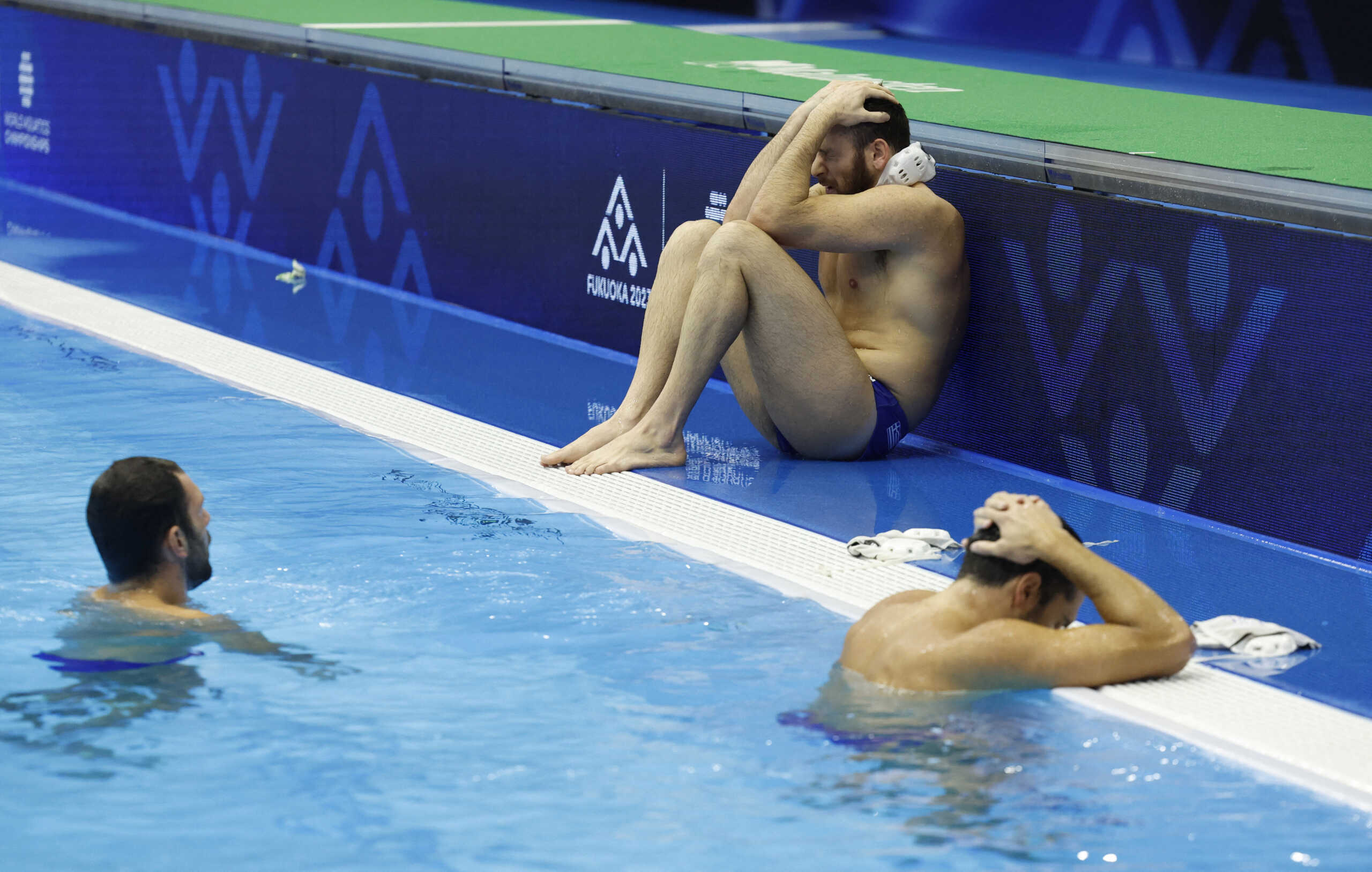 Fukuoka 2023 World Aquatics Championships - Water Polo - Men's Gold Medal Match - Greece v Hungary - Marine Messe Fukuoka Hall B, Fukuoka, Japan - July 29, 2023 Greece players look dejected after the match REUTERS