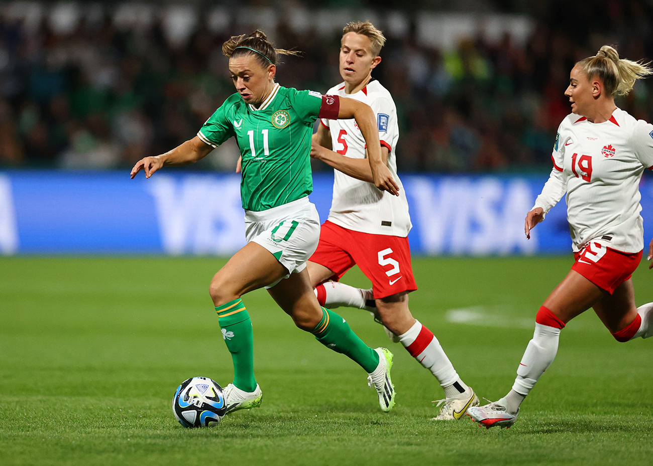 Soccer Football - FIFA Women’s World Cup Australia and New Zealand 2023 - Group B - Canada v Republic of Ireland - Perth Rectangular Stadium, Perth, Australia - July 26, 2023
Republic of Ireland's Katie McCabe in action with Canada's Quinn REUTERS