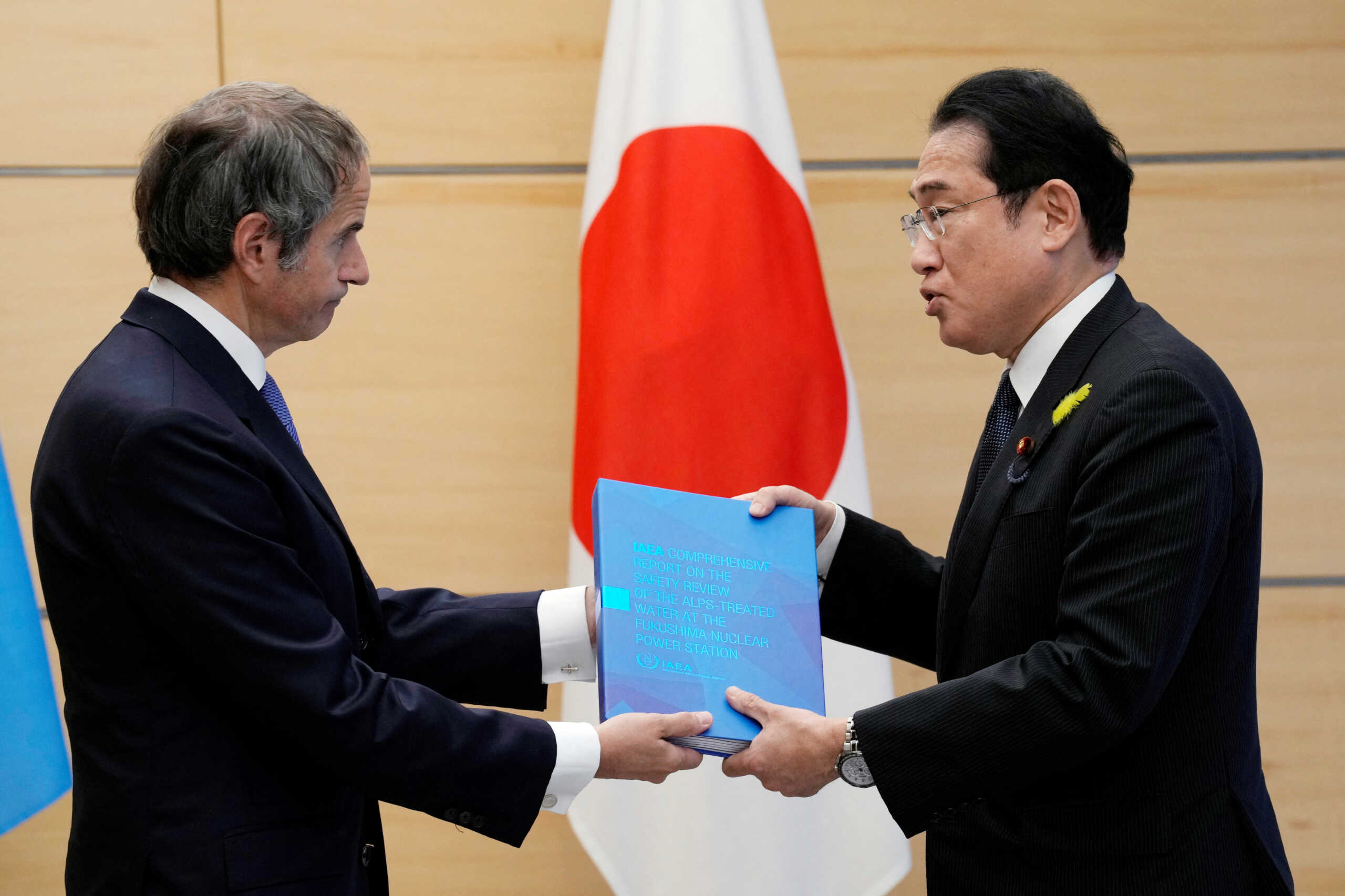 Rafael Mariano Grossi, Director General of the International Atomic Energy Agency, presents IAEA's comprehensive report on Fukushima Treated Water Release to Japanese Prime Minister Fumio Kishida, at the prime minister's office, in Tokyo, Japan July 4, 2023. Eugene Hoshiko