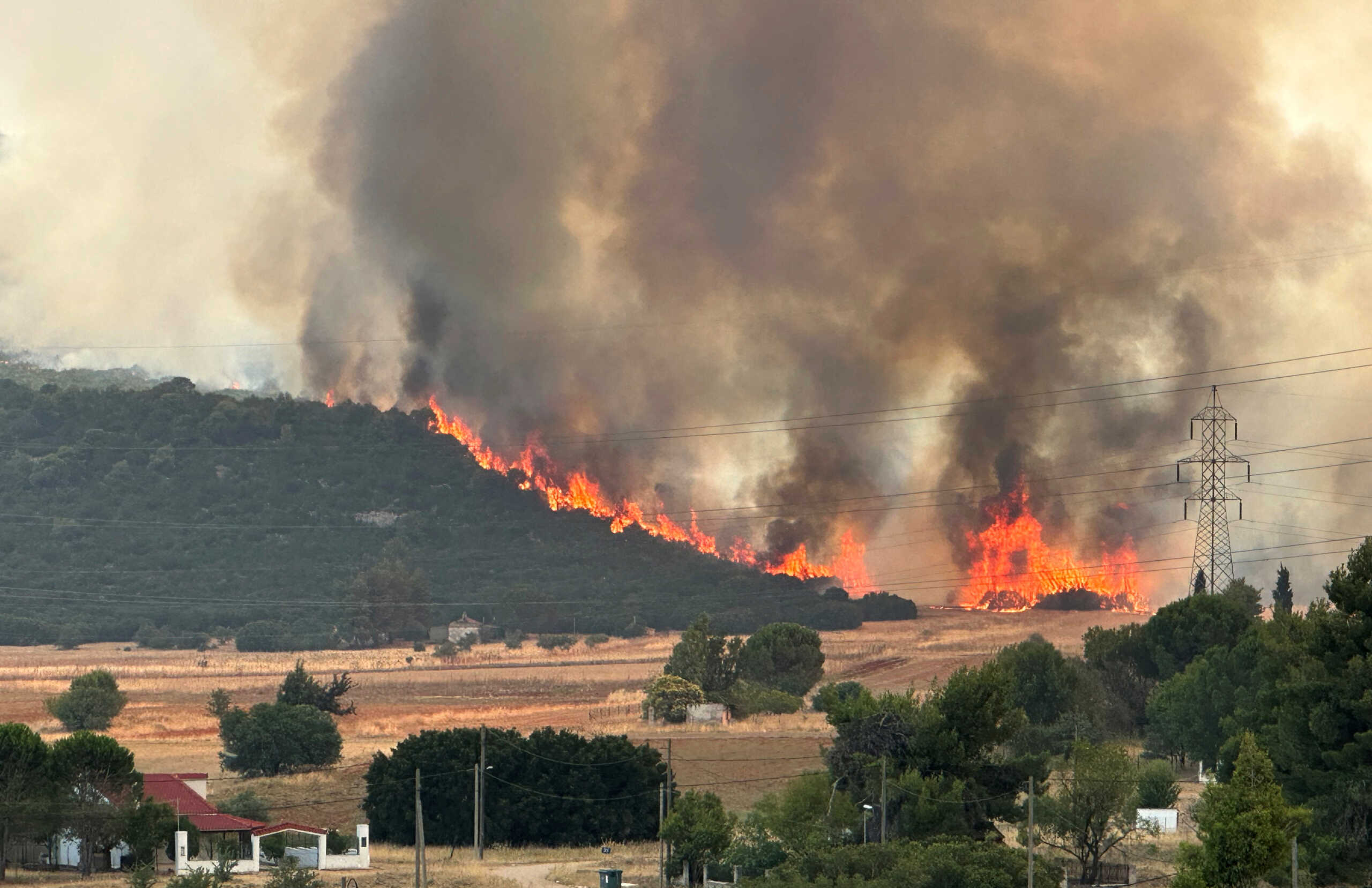 Smoke rises from a wildfire near the village of Agios Sotira, west of Athens, Greece, July 20, 2023. REUTERS