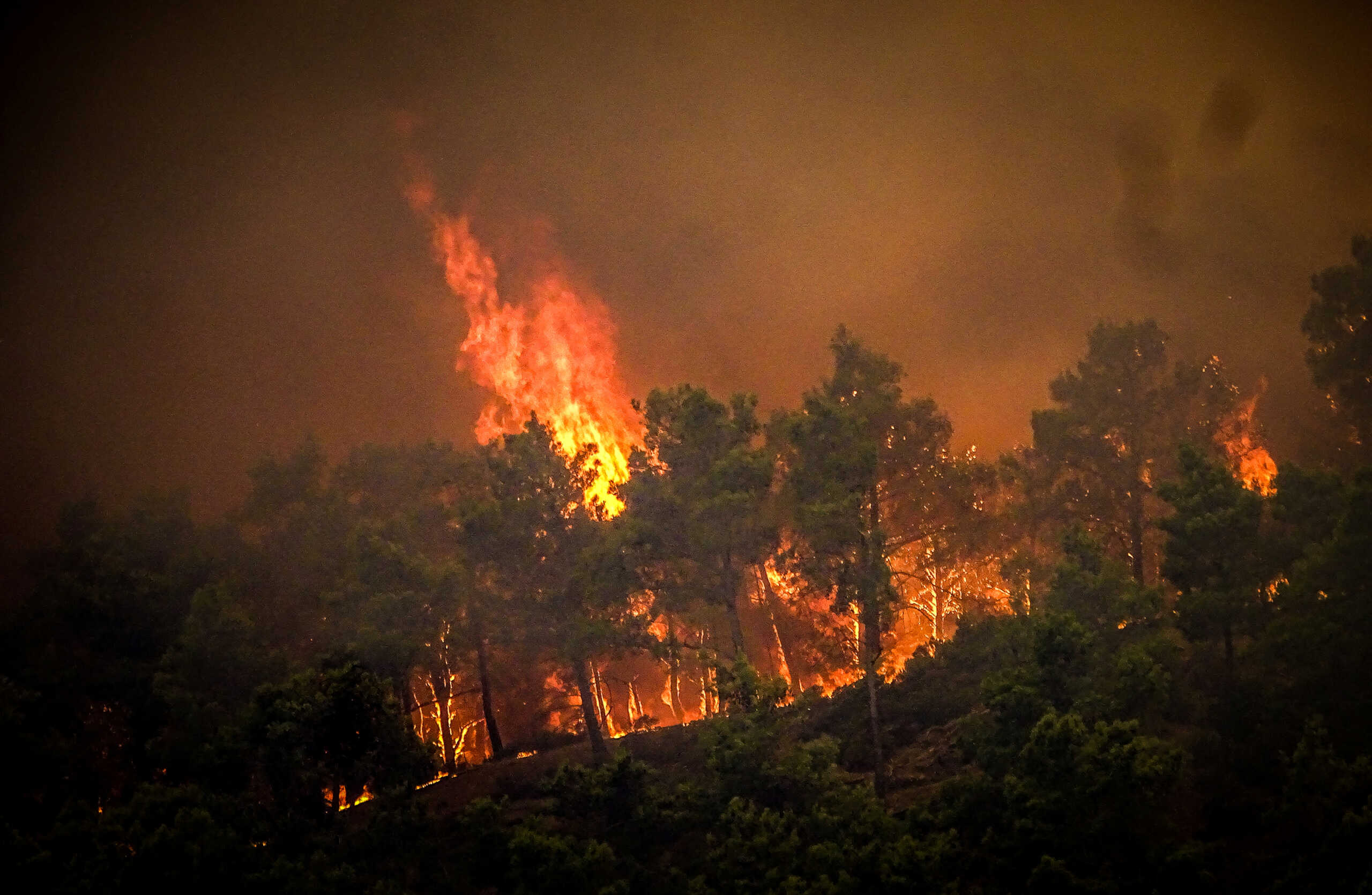 Smoke rises from a wildfire on the island of Rhodes, Greece, July 22, 2023. Argiris Mantikos