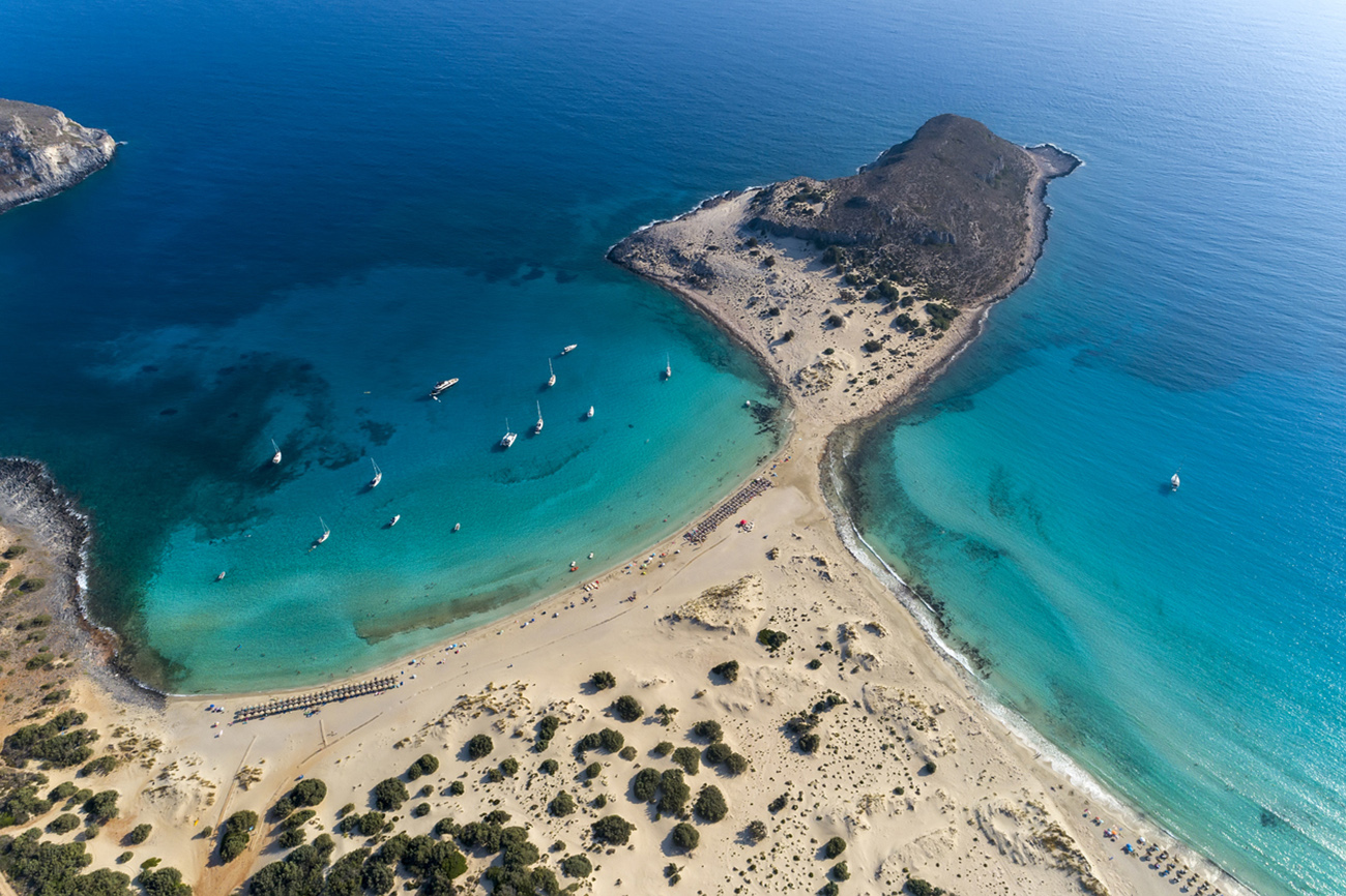 Aerial view of Simos beach in Elafonisos island in Greece. Elafonisos is a small Greek island the Peloponnese with idyllic exotic beaches and crystal clear waters. Laconia, Greece, Europe