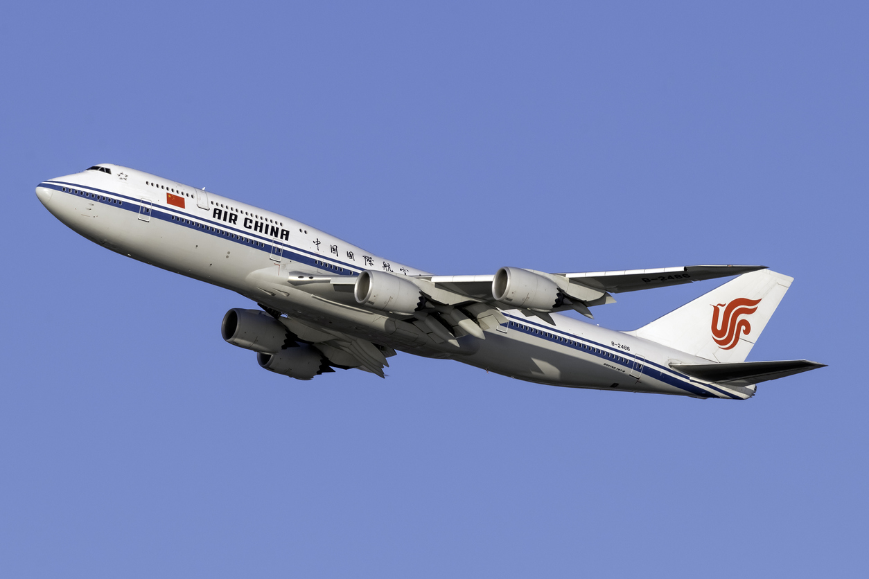United States of America, New York: Air China Boeing 747-89L Registration B-2486, departing out of New York City's JFK International Airport on a day with clear blue skies