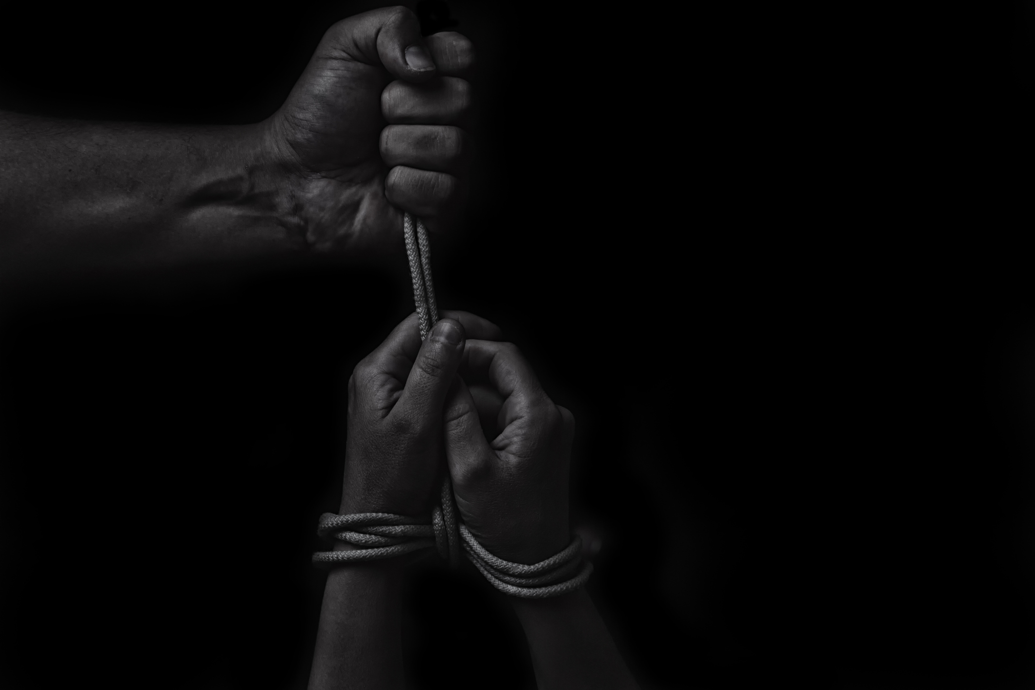 woman hands bound prisoner in room,hands bound