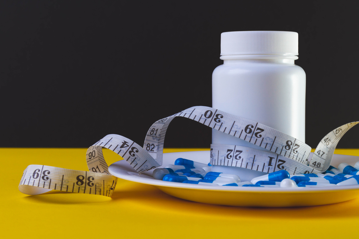 Weight loss pills. Obesity treatment. Overweight problems. Biologically active food supplement.