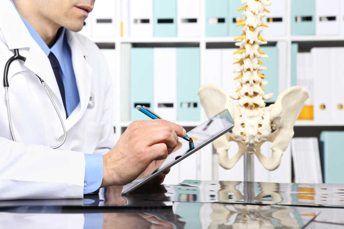 Radiologist doctor with digital tablet checking xray, healthcare, medical and radiology concept