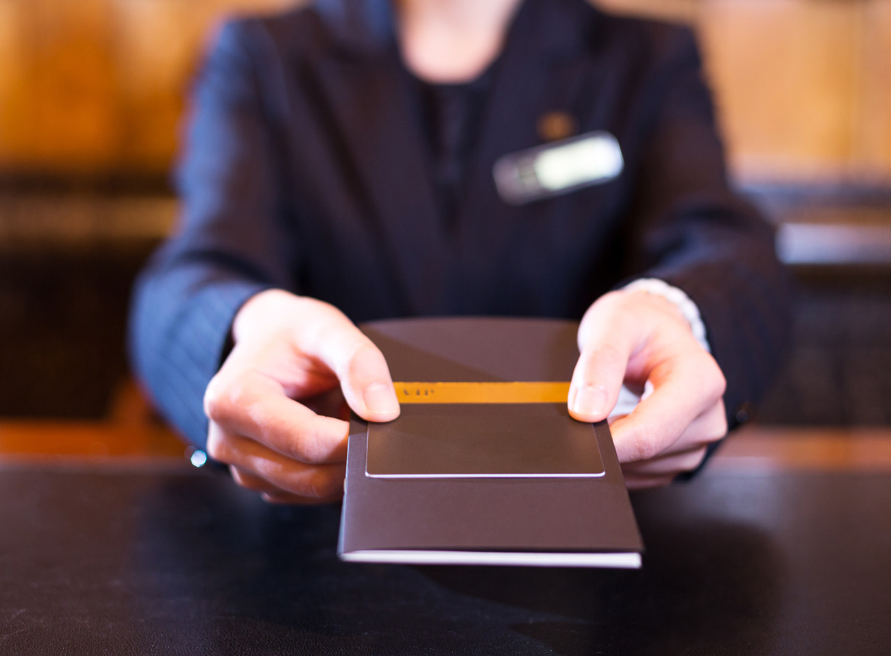 hand with credit card in luxury hotel