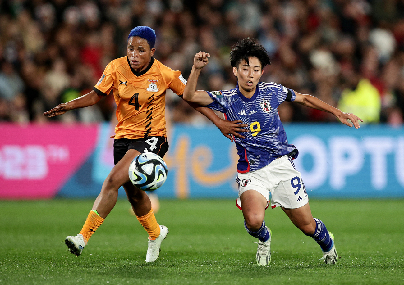 Soccer Football - FIFA Women’s World Cup Australia and New Zealand 2023 - Group C - Zambia v Japan - Waikato Stadium, Hamilton, New Zealand - July 22, 2023
Zambia's Susan Banda in action with Japan's Riko Ueki REUTERS