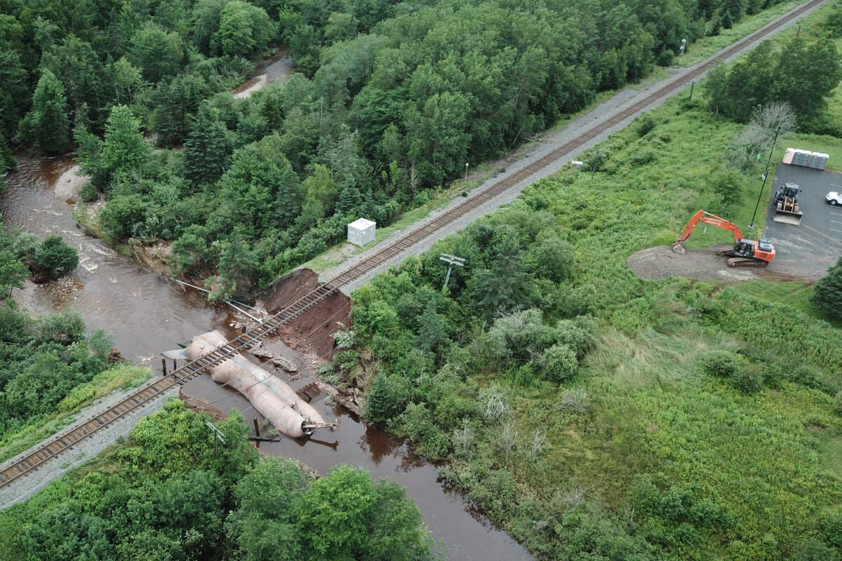 Water flows through a washed-out culvert on the main CN Rail line which leads to the port of Halifax, after the heaviest rain to hit the Atlantic Canadian province of Nova Scotia in more than 50 years triggered floods, in Truro, Nova Scotia, Canada July 23, 2023.  Nigel Gloade