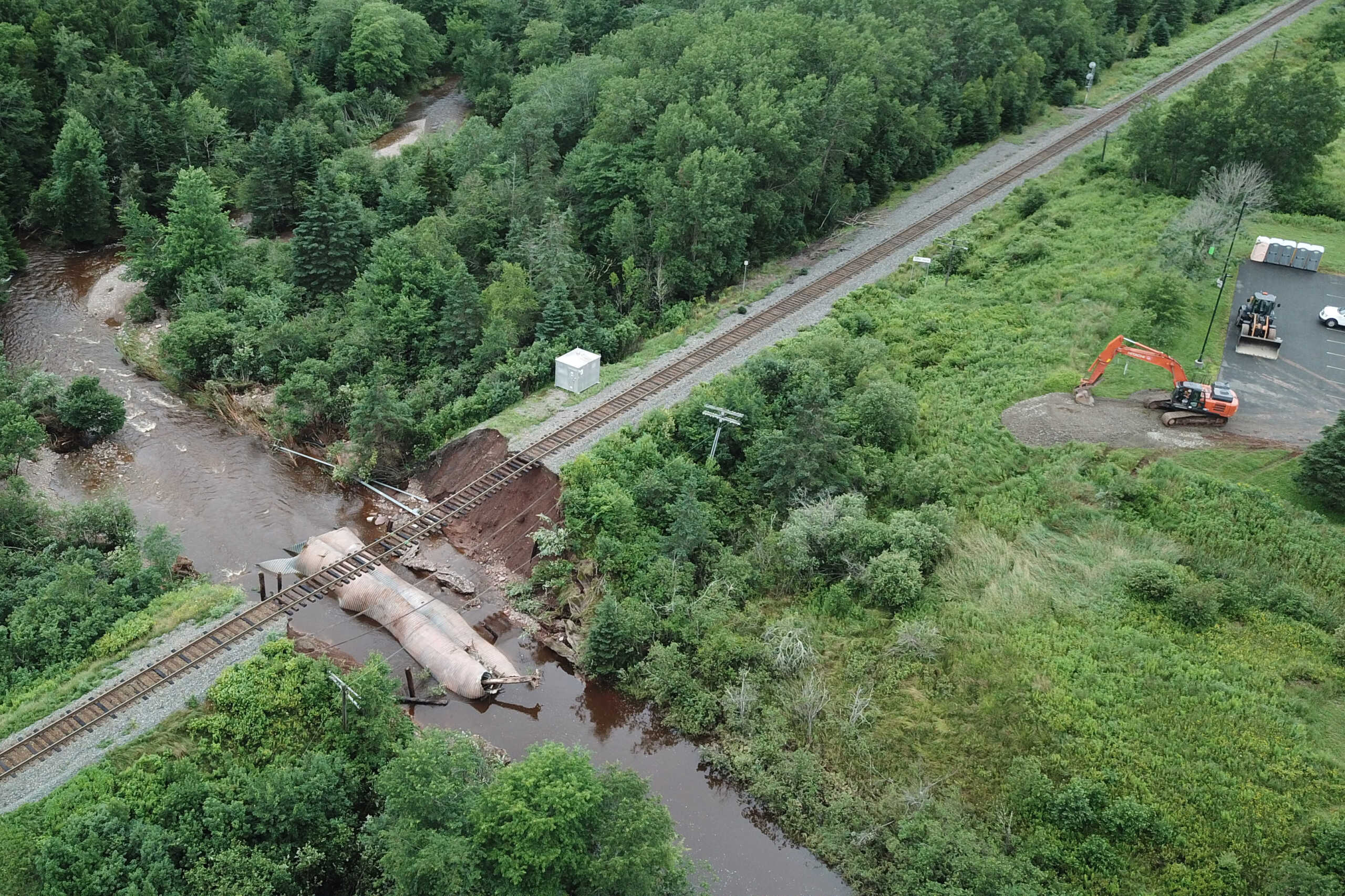 Water flows through a washed-out culvert on the main CN Rail line which leads to the port of Halifax, after the heaviest rain to hit the Atlantic Canadian province of Nova Scotia in more than 50 years triggered floods, in Truro, Nova Scotia, Canada July 23, 2023.  Nigel Gloade