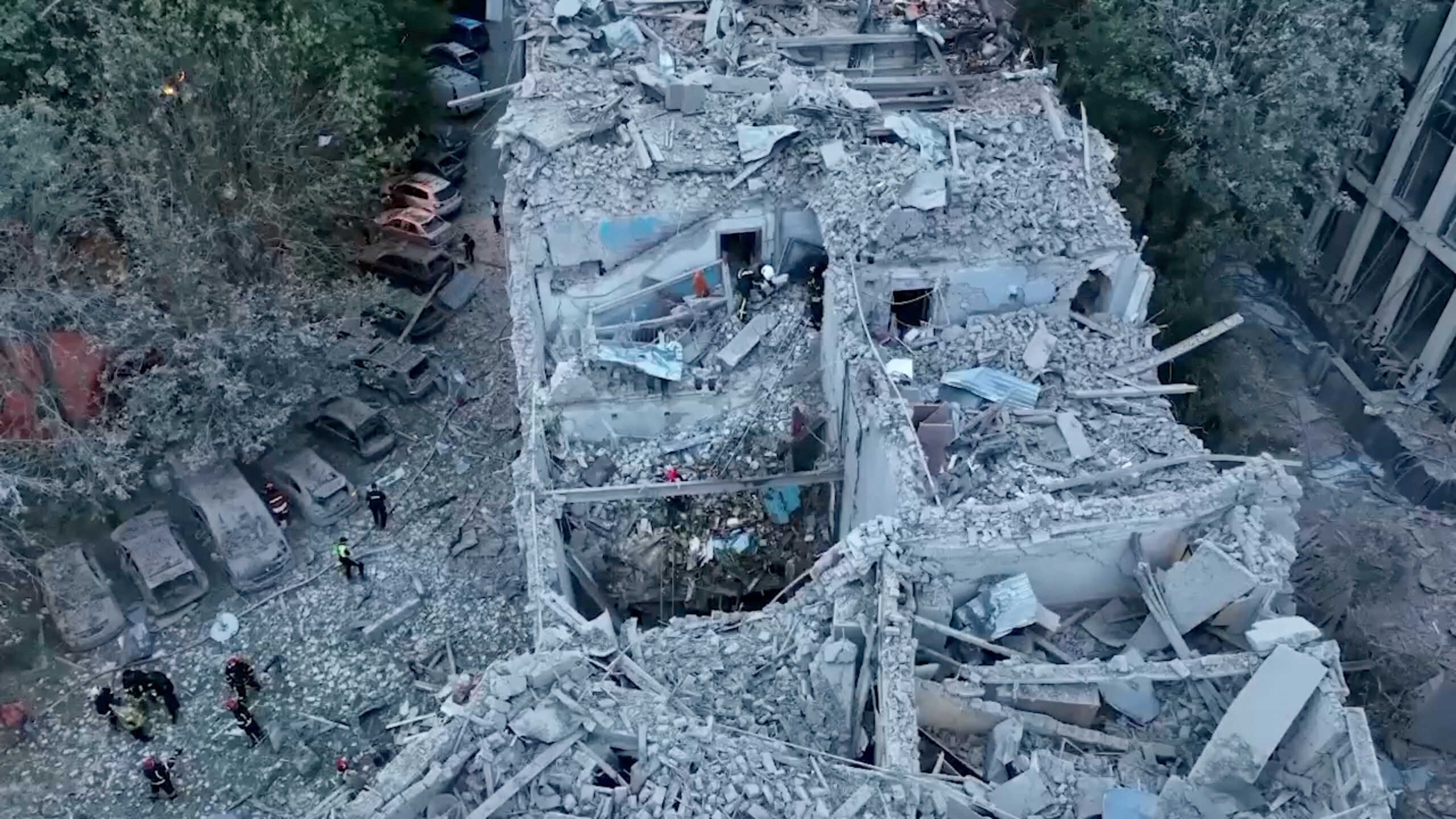Rescue workers respond to a Russian rocket strike that hit an apartment building, amid Russia's attack on Ukraine, in Lviv, Ukraine in this screen grab obtained from a handout video released on July 6, 2023. Presidential Press Service
