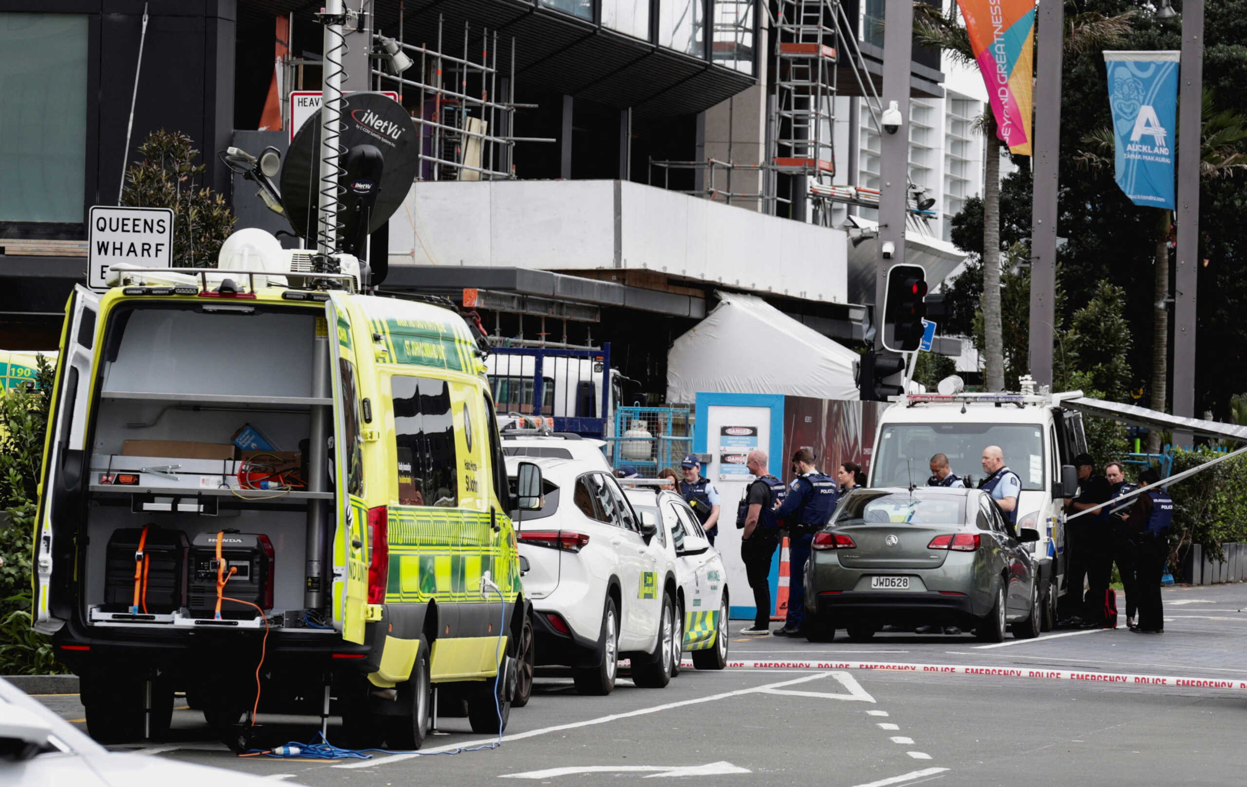 Police cars and ambulances are seen near a construction site following a shooting in the central business district, in Auckland, New Zealand July 20, 2023. REUTERS