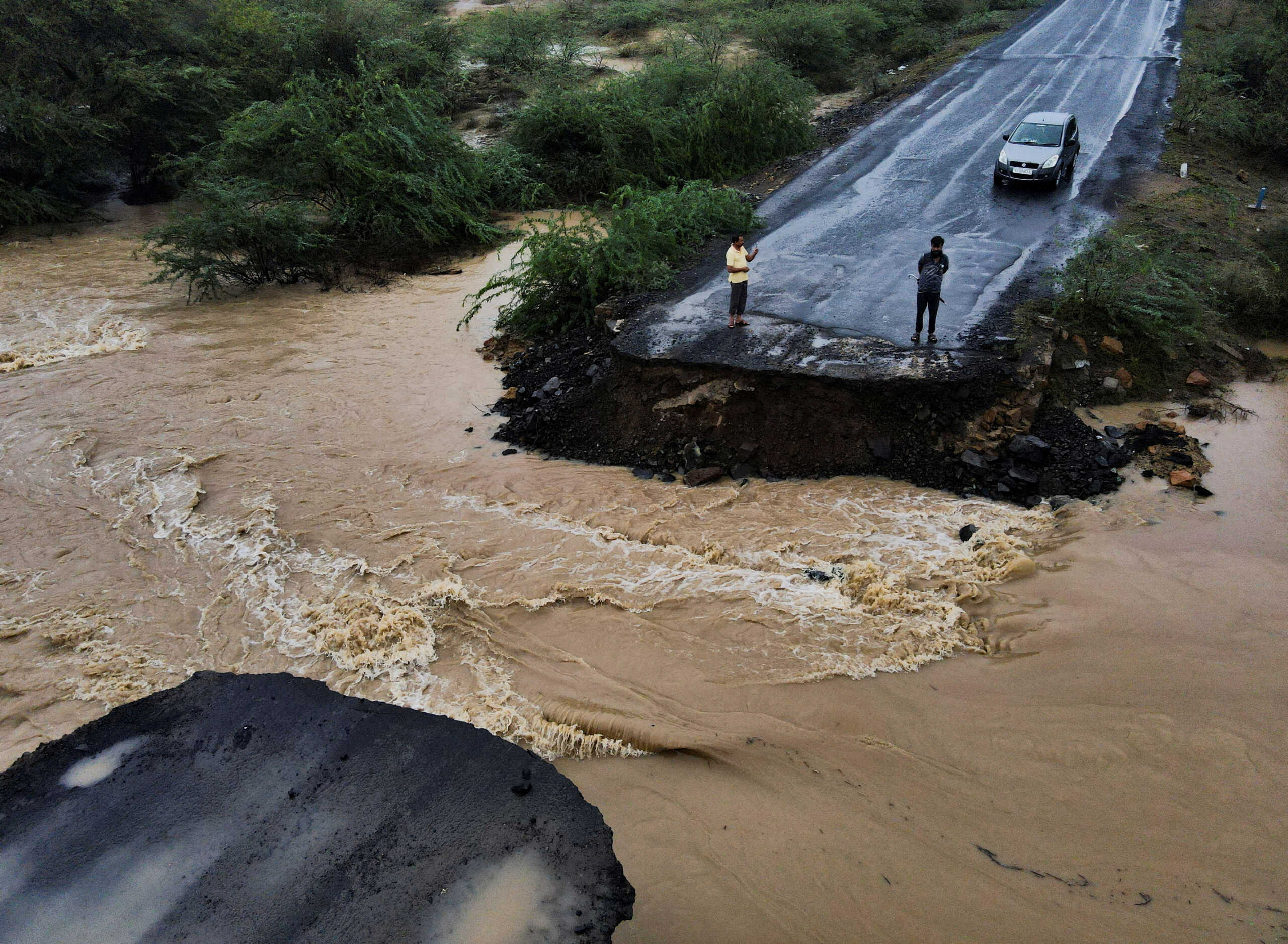 A drone view of a broken bridge, after Cyclone Biparjoy made landfall, along the Naliya-Bhuj highway, in the western state of Gujarat, India, June 16, 2023. REUTERS