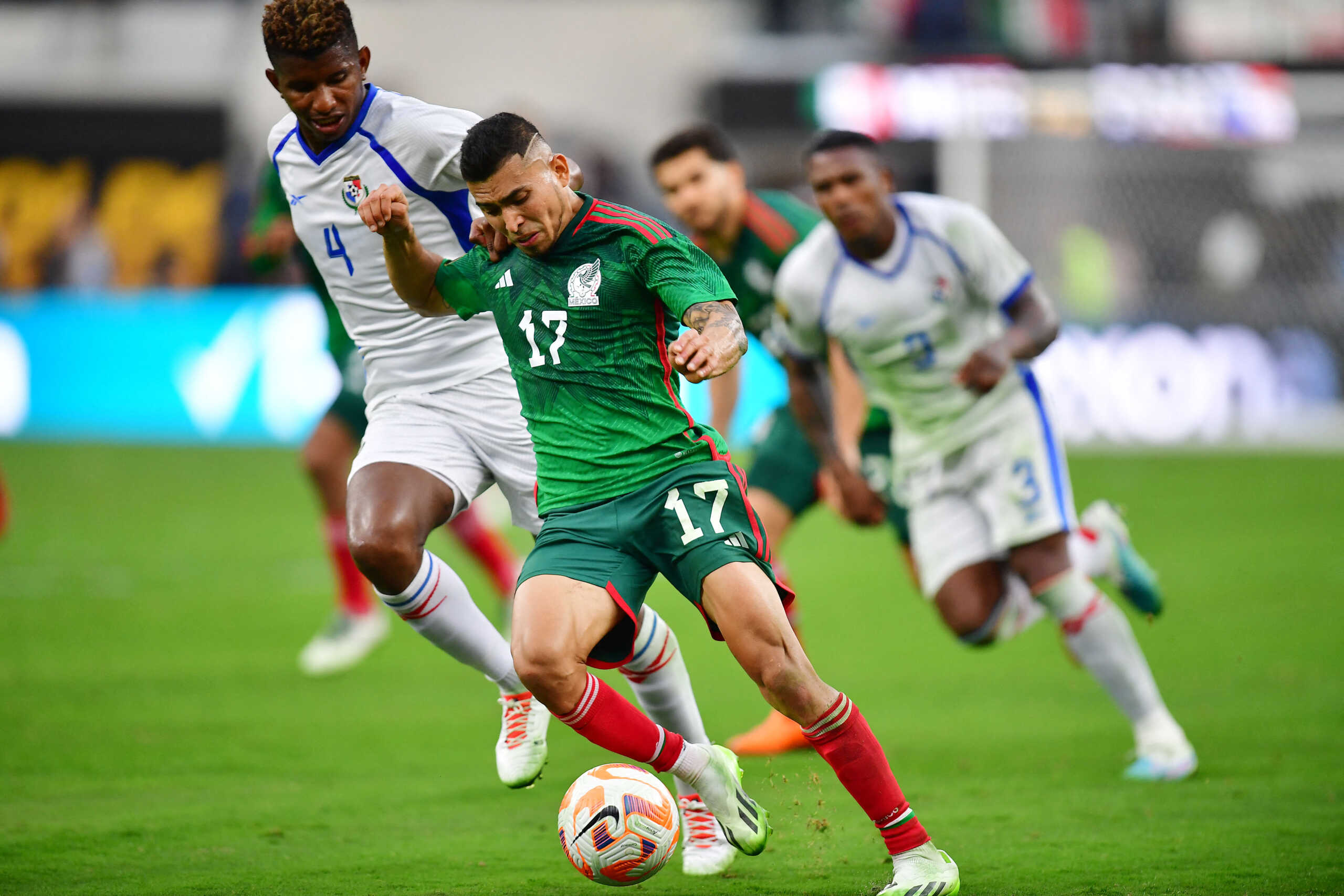 Jul 16, 2023; Inglewood, California, USA; Mexico midfielder Orbelín Pineda (17) moves the ball against Panama defender Fidel Escobar (4) during the second half at SoFi Stadium. Mandatory Credit: Gary A. Vasquez-USA TODAY Sports