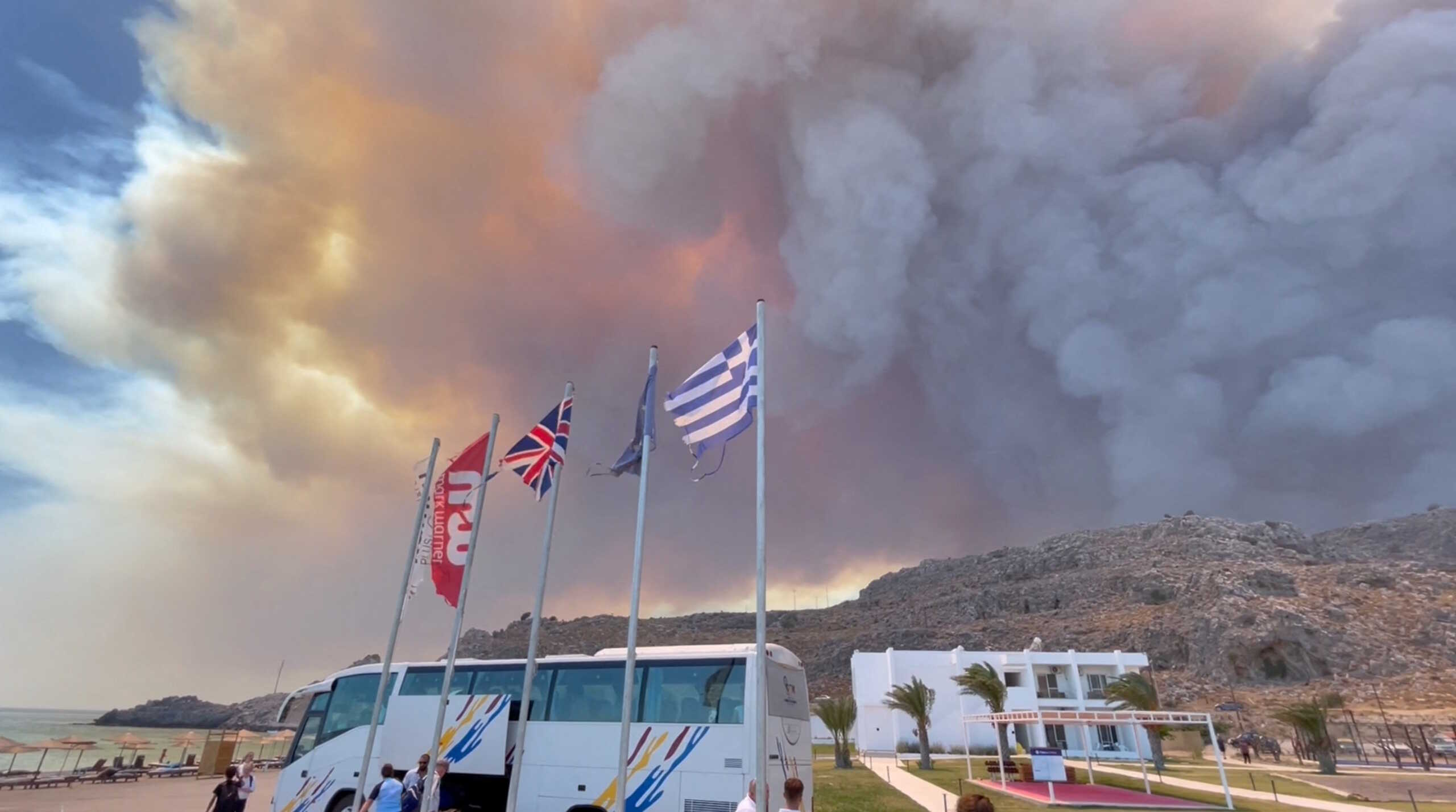 Smoke rises from a wildfire in Rhodes Island, Greece, July 22, 2023 in this screengrab taken from a social media video. Tiktok