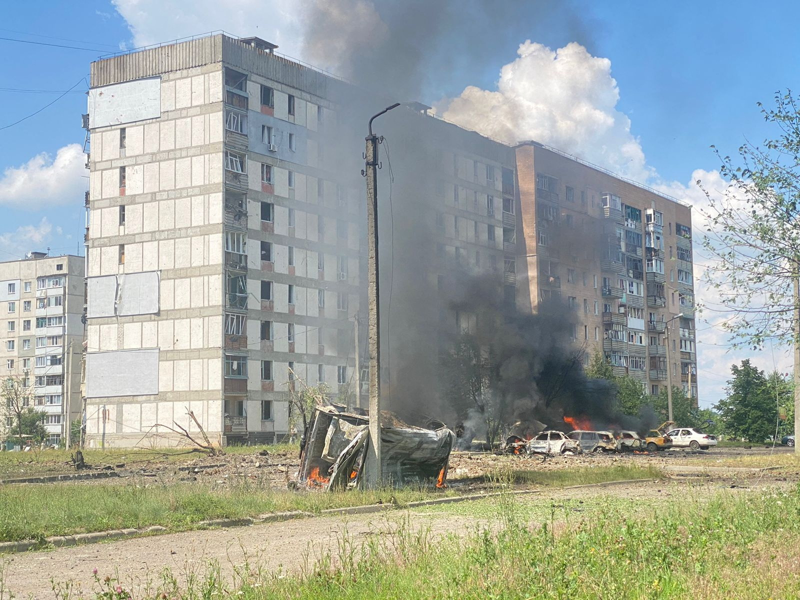 Cars burn at a site of a Russian military strike in the town of Pervomaiskyi, amid Russia's attack on Ukraine, in Kharkiv region, Ukraine July 4, 2023. Press service of the National Police of Ukraine