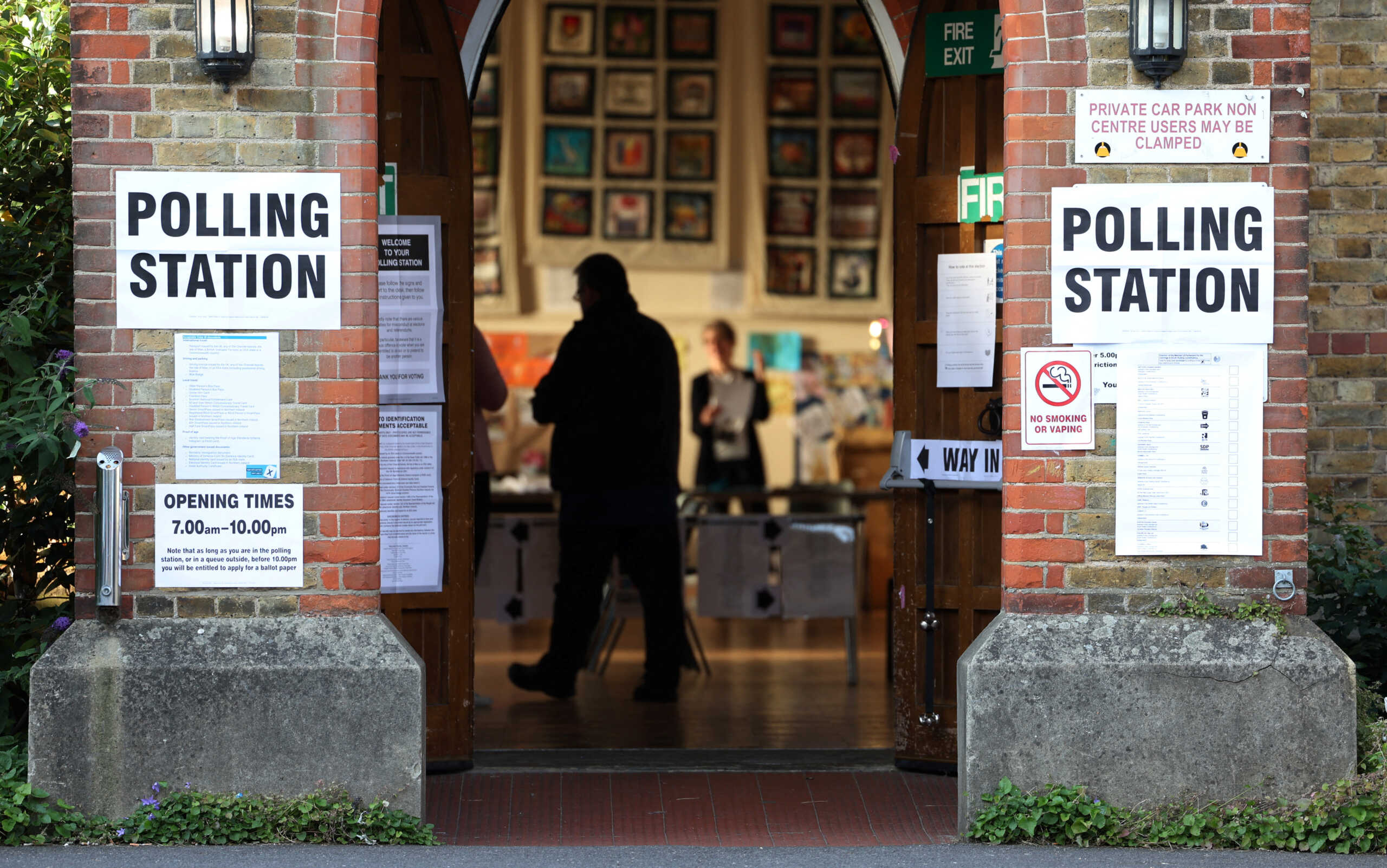 A man enters a polling station to vote during the by-election to choose the successor to Boris Johnson's seat in Britain's parliament in Uxbridge, Britain, July 20, 2023. REUTERS