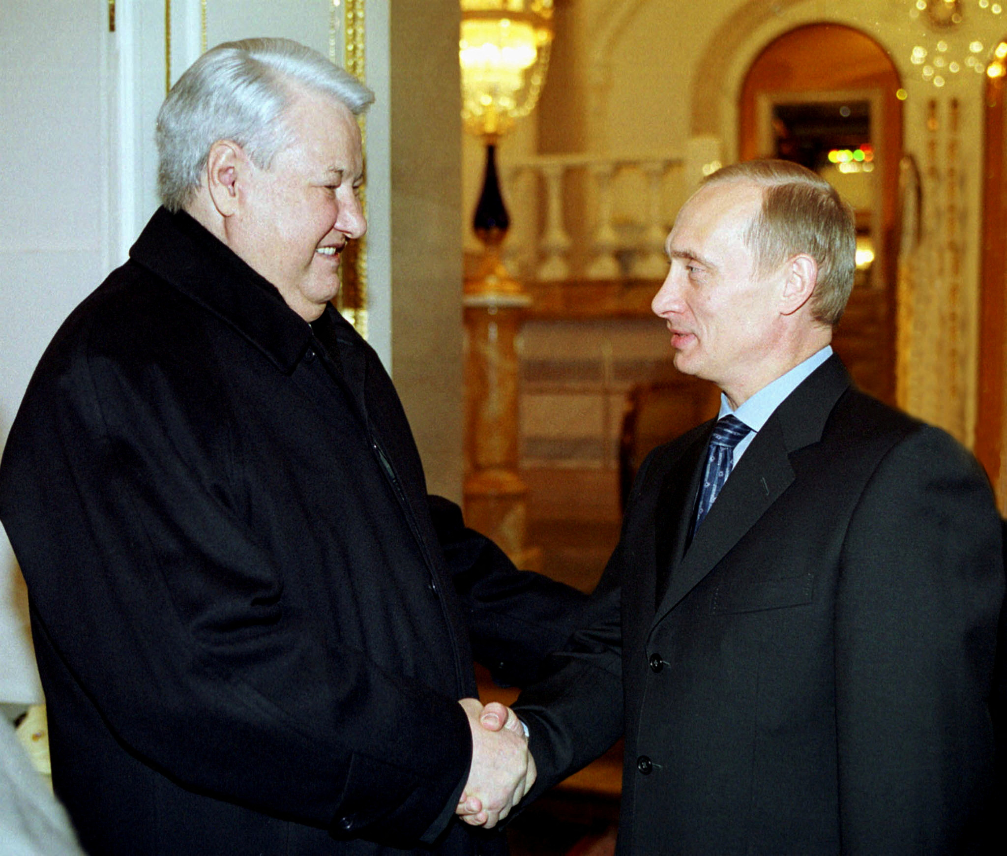 FILE PHOTO: Russian President Vladimir Putin (R) shakes hands with former Russian President Boris Yeltsin in the Kremlin in Moscow, December 31, 2000. Putin met Yeltsin for talks on the country's economic and social situation on Sunday, a year to the day when Yeltsin resigned and handed the reins of power to Putin. REUTERS