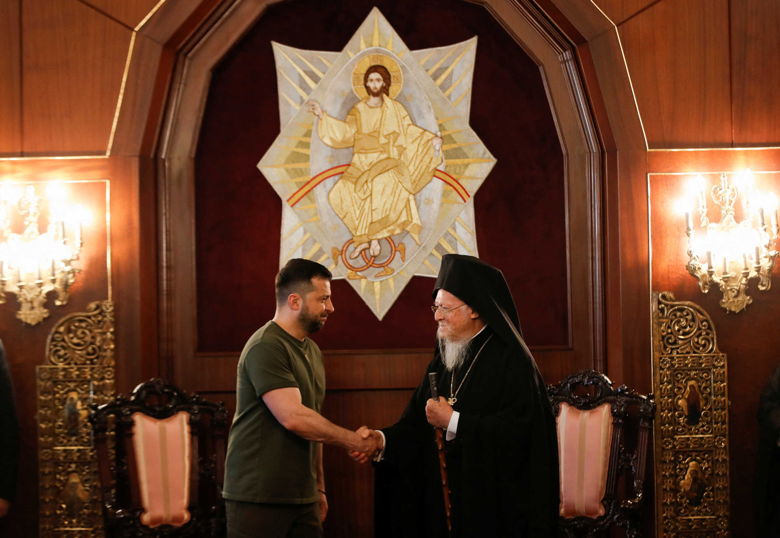 Ecumenical Patriarch Bartholomew I shakes hands with Ukraine's President Volodymyr Zelenskiy as they attend a joint press conference in Istanbul, Turkey July 8, 2023. REUTERS