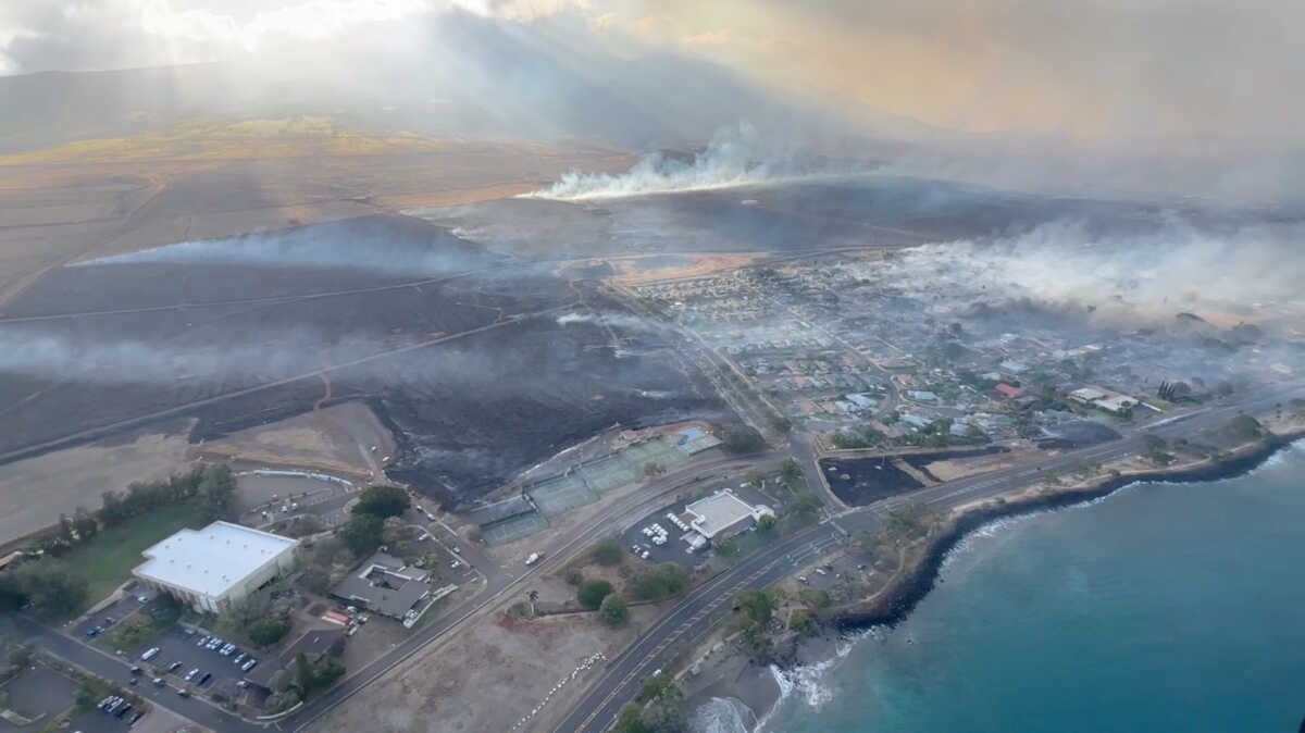 An aerial view as smoke rises from burnt areas amidst wildfires in Maui, Hawaii, U.S., August 9, 2023, in this screenshot taken from a social media video. Vince Carter
