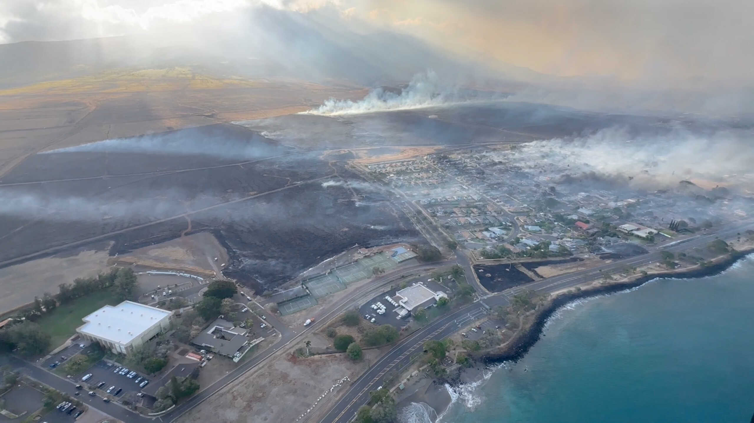 An aerial view as smoke rises from burnt areas amidst wildfires in Maui, Hawaii, U.S., August 9, 2023, in this screenshot taken from a social media video. Vince Carter