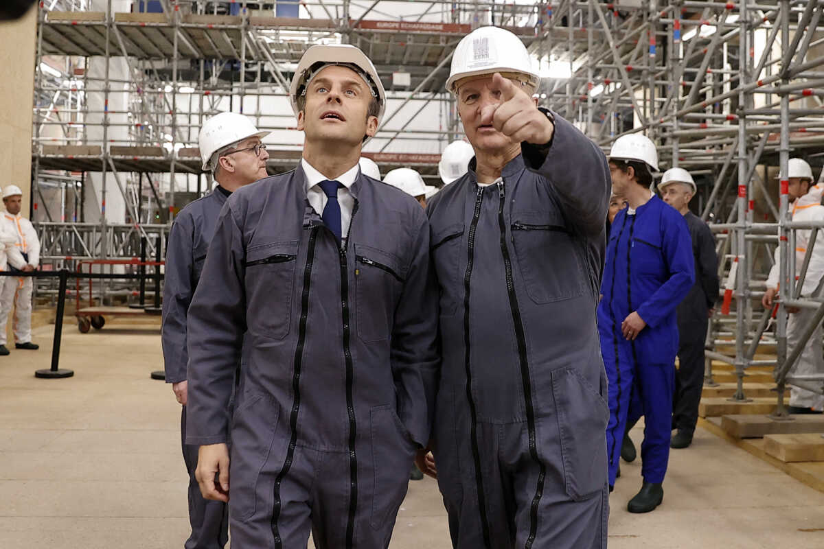 FILE PHOTO: French Army General Jean-Louis Georgelin leads the visit of French President Emmanuel Macron at the reconstruction site of the Notre-Dame de Paris Cathedral, which was damaged in a devastating fire three years ago, as restoration works continue, in Paris, France, April 15, 2022. Ian Langsdon