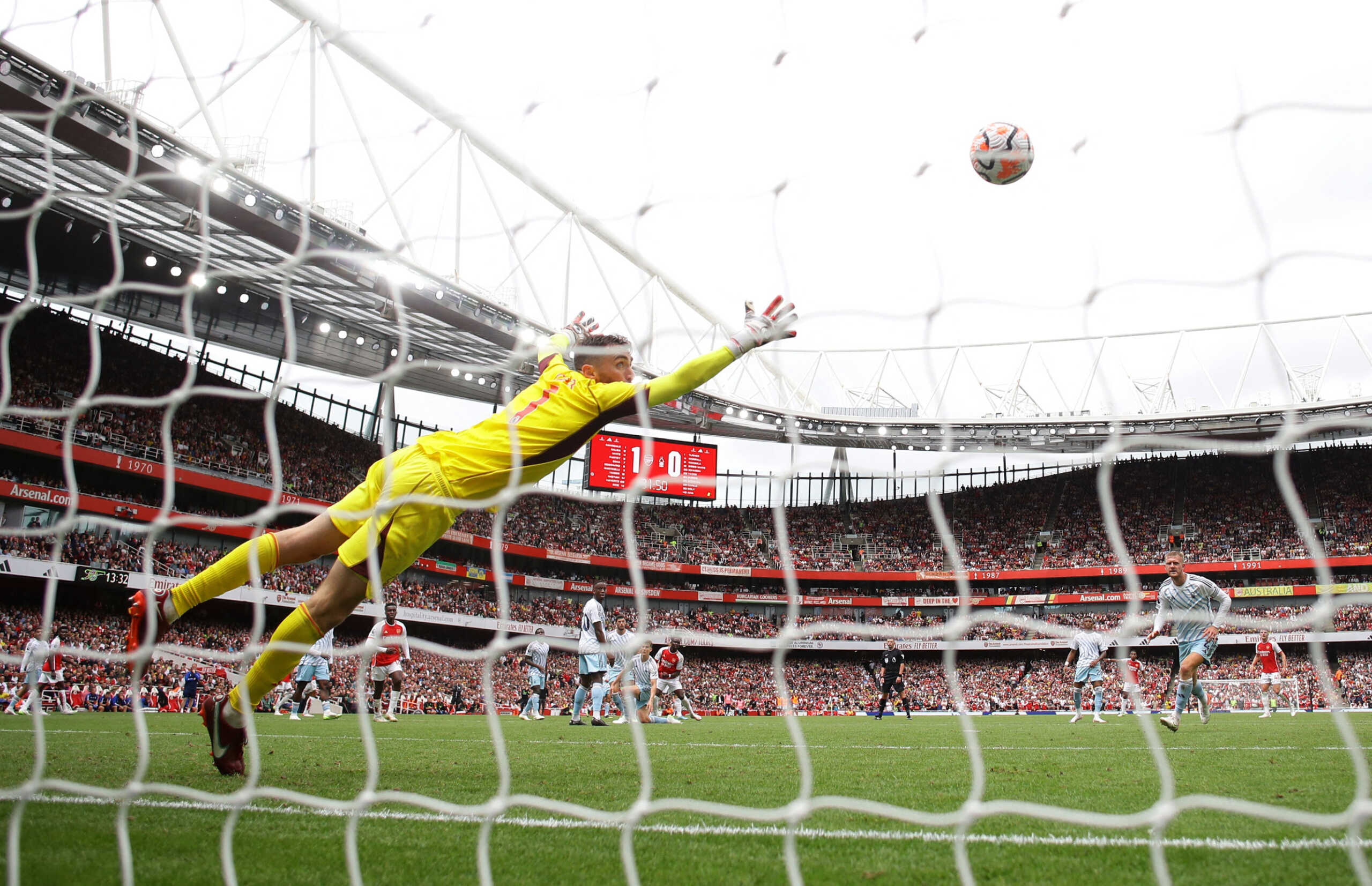 Soccer Football - Premier League - Arsenal v Nottingham Forest - Emirates Stadium, London, Britain - August 12, 2023 Arsenal's Bukayo Saka scores their second goal past Nottingham Forest's Matt Turner REUTERS