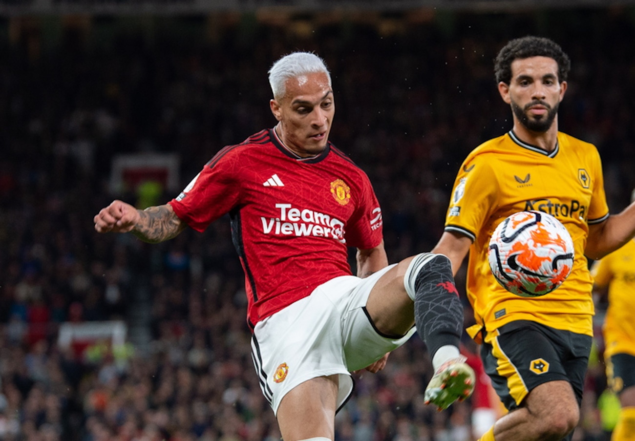 epa10800407 Manchester United's Antony (L) in action with Wolverhampton Wanderers Rayan Ait-Nouri during the English Premier League match between Manchester United and Wolverhampton Wanderers in Manchester, Britain, 14 August 2023.  EPA
